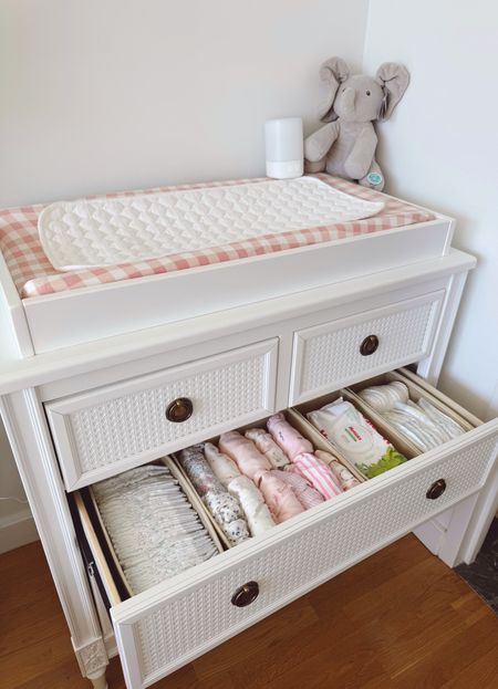 Organizing our changing station! These foldable box organizers are perfect for keeping everything in place! #babies Baby dresser and changing station 💕💕💕 Drawer dresser, Nanit sound and light, foldable box drawer organizer, changing pad, waterproof liners for changing pad (these are an absolute must-have). Baby girl onesies (I included the ones that are linkable).

#LTKHome #LTKFamily #LTKBaby