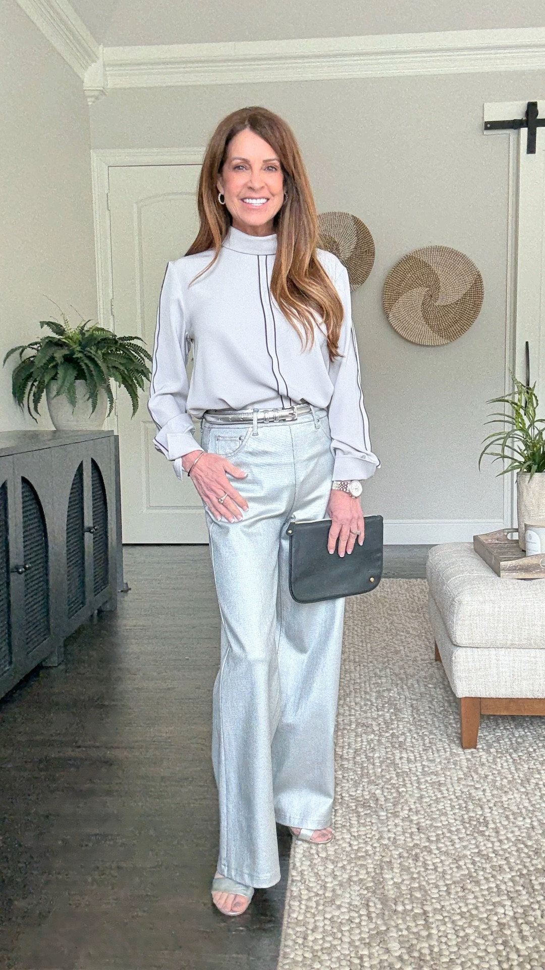 A fun holiday outfit to wear now and later. The blouse has a unique reverse collar. The pants have a hidden smoothing waistband. They’re a silver metallic coated denim. This brand runs tts. The pants have a 28” inseam which fits full length for me at 5’1”. I’m wearing size small in both pieces.