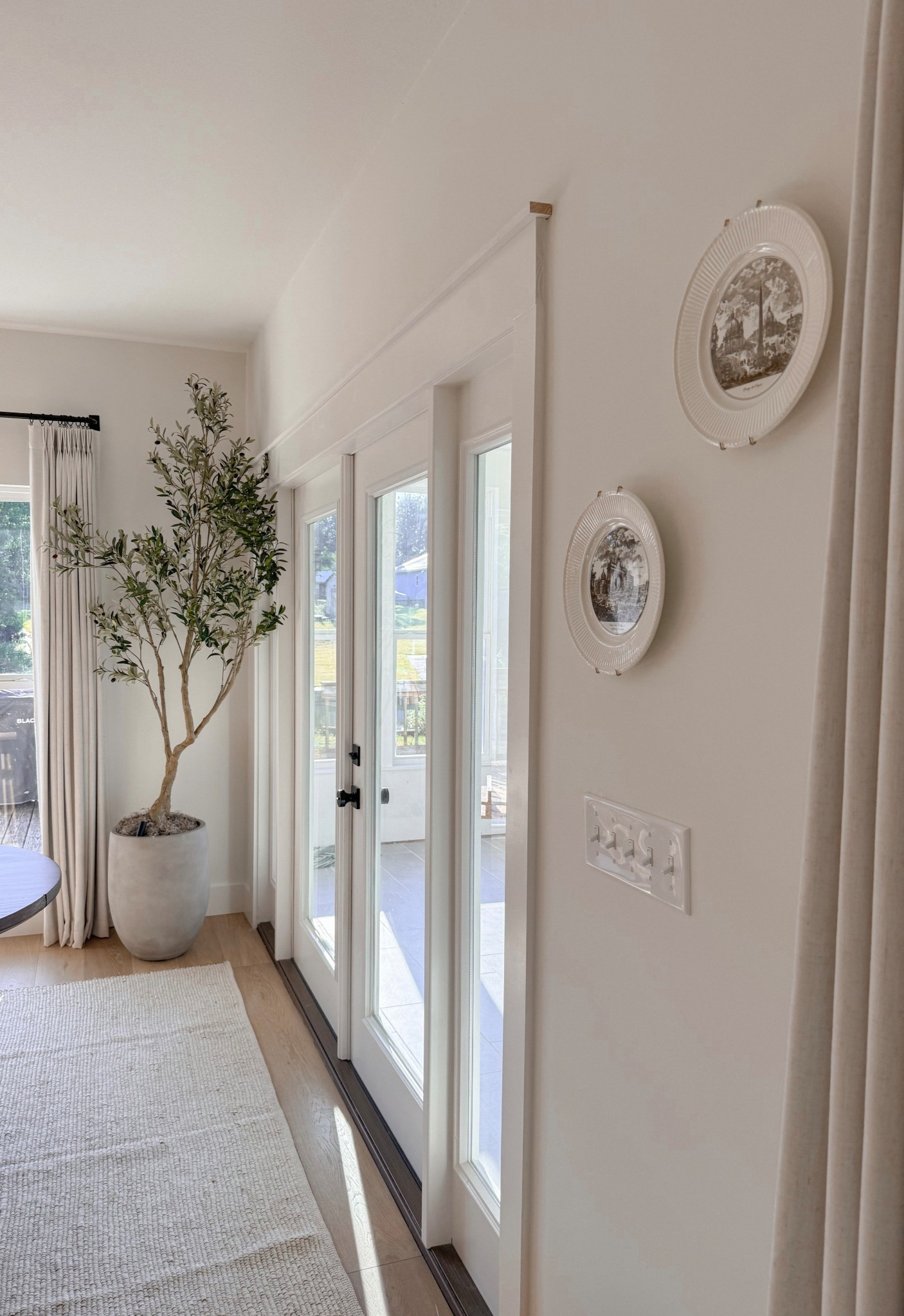 Plate mount. Wall decor. Faux olive tree. Planter. Rug. Jute rug. Curtain. Curtain rod  

#LTKHome