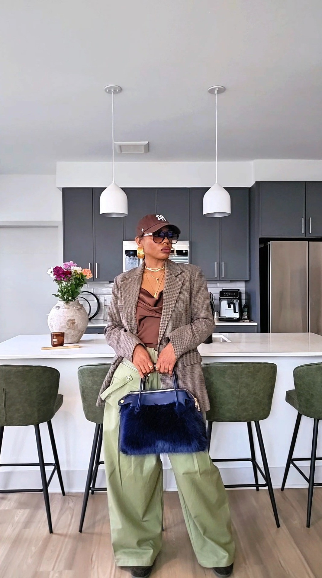 Warm Winter Day OOTD | Slouchy Chic Street Style OutfitWarm winter day OOTD with my go-to slouchy layers.Relaxed tailoring is my secret for days when it’s chilly but not cold — oversized blazer, soft textures, and effortless proportions always hit. Styling tip: balance slouchy bottoms with a structured blazer to keep the look polished, not sloppy.And yes… this is my emotional support bag.If you remember the unboxing, she’s still doing the work. This fuzzy navy beauty is from Anthropologie, and I love how it adds texture and contrast to neutral outfits.Warm winter outfit, faux fur, street wear

#LTKgrwm #LTKPetite #LTKootd