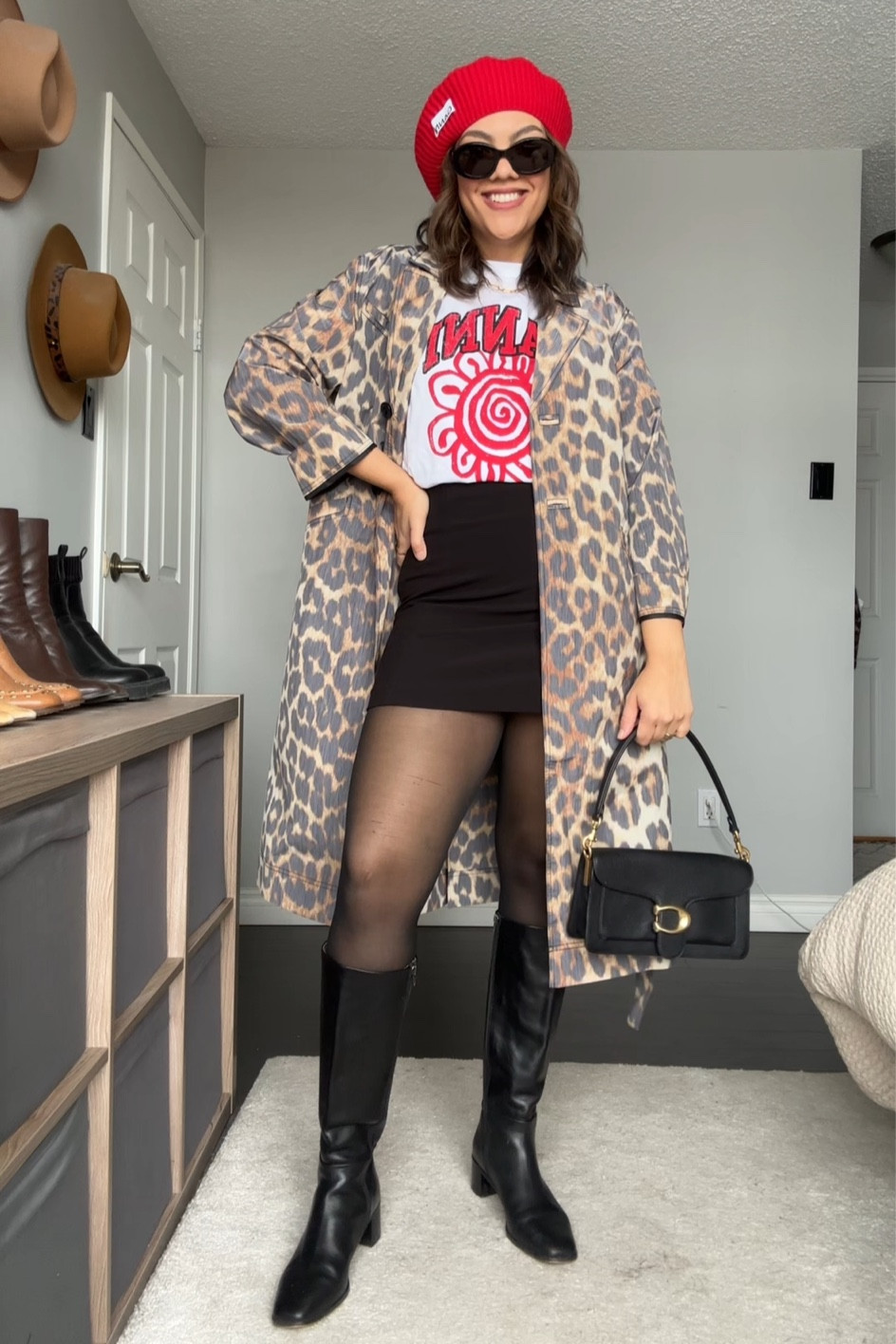 Styling a leopard print trench coat! Details below:
-Ganni leopard print trench coat. I have a size 40. 
-Ganni red beret, other colours linked. 
-Ganni graphic print T-shirt, similar linked (I have a large). 
-Dynamite black mini skirt. 
-H&M tights in black, I have a large. 
-Coach tabby bag in black pebble leather. 
-Madewell knee high black leather boots  
-Celine Triomphe sunglasses. 

#LTKMostLoved #LTKSeasonal #LTKstyletip
