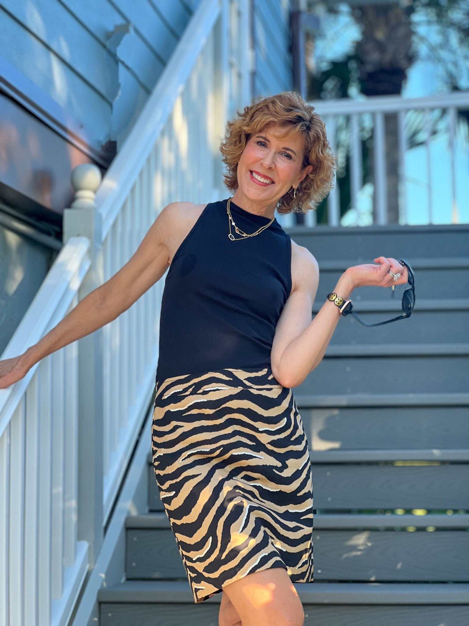 Fall Outfit, fall skirt, fall top, Animal print skirt, leopard print skirt, mock turtleneck, sleeveless turtleneck, black top, black mock turtleneck,
Black tank, black booties, black suede booties, black boots, gold
Necklaces, black earrings, black Apple Watch band

This classic mock turtleneck sleeveless tank is the ideal fall
layering piece. I love it paired with this twill animal print skirt that is 25% off right now. Add a moto black jacket if it’s cool outside and add black boots or booties.

#LTKshoecrush #LTKSeasonal #LTKsalealert