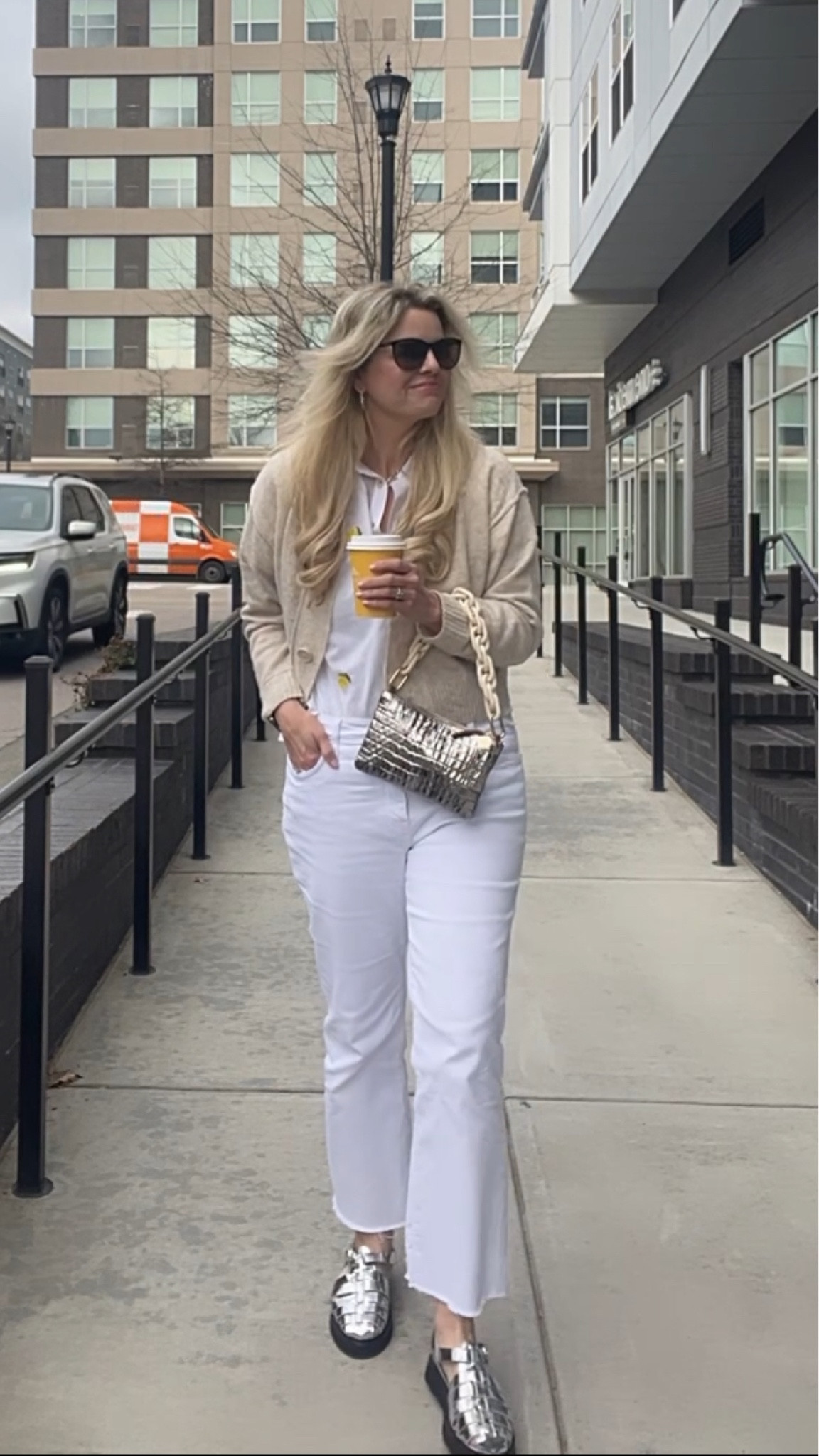 When life gives you lemons, I’ll just go get coffee 😂Coffee, especially with a bestie, just seems to make everything better. Loved adding a little bit of fun with this cute button down with the lemons which is part of the LTK spring sale this weekend. So fun for spring and summer and will also look cute with shorts and skirts. The embroidery is just gorgeous on this top. It is a little sheer so I wear a tank with it but so pretty and lightweight for summer. Wearing with my cardigan and shoes that are also part of the LTK spring sale right now. See more on sizing and fit in my LTK shop.

SIZING - lemon top - would recommend sizing down 
Sweater - sized down two sizes to an XS
Jeans - would recommend sizing down 
Shoes - same as my regular flats size and birks size - a 40
Feel free to always comment or DM me with any sizing questions! 

Mom style, casual style , spring outfit, travel outfit, work wear, spring capsule, spring sweater  , mom outfit, neutral fashion, casual style, vacation outfit, dress, trench coat, rainy day style,White jeans, wide leg jeans, baggy jeans, travel outfit, Spring dress, summer dressy
#LTKSpringSale

#LTKover40 #LTKitbag