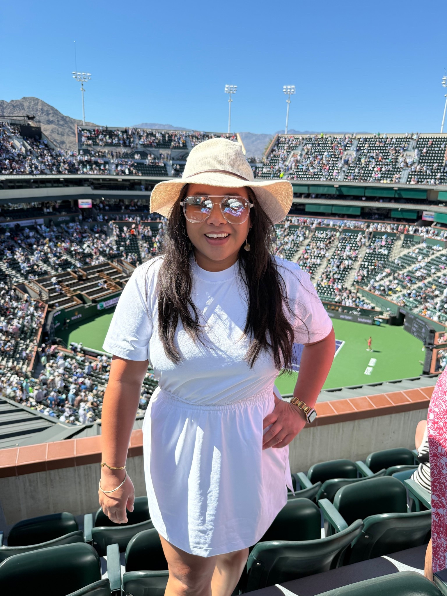 BNP Paribas Indian Wells Outfit Idea

Sharing what I wore for a sunny day at the tennis in Indian Wells. I love an outfit that feels effortless but still a little elevated for a full day walking the grounds and watching matches.

My base piece was a white tee dress from lululemon. It is one of those easy staples that always works because the waist is slightly cinched so it still feels flattering and feminine while staying comfortable for a full day out.

To elevate the look a bit I added a tan hat which gave the outfit a polished, sun ready feel. Platform reebok sneakers added some height while still being practical for all the walking around the tournament.

Accessories made the outfit feel playful and girly. I wore citrine drop hoop earrings which add the prettiest warm glow against neutral tones, along with clear frame aviator sunglasses that felt fresh and sporty for a bright desert day.

Easy, sporty, and a little elevated for a day at the BNP Paribas Open.

#bnpparibasopen #indianwellstennis #tennisoutfit #tennisstyle #lululemonstyle #teedress #sportyoutfit #athleisurestyle #platformsneakers #springtennisstyle

bnpparibas open outfit | indian wells tennis outfit | tennis tournament outfit ideas | lululemon tee dress outfit | sporty chic outfit | tennis spectator style | athleisure outfit ideas | platform reebok sneakers outfit | clear aviator sunglasses outfit | spring tennis fashion | desert tennis style

#LTKActive #LTKMidsize #LTKootd