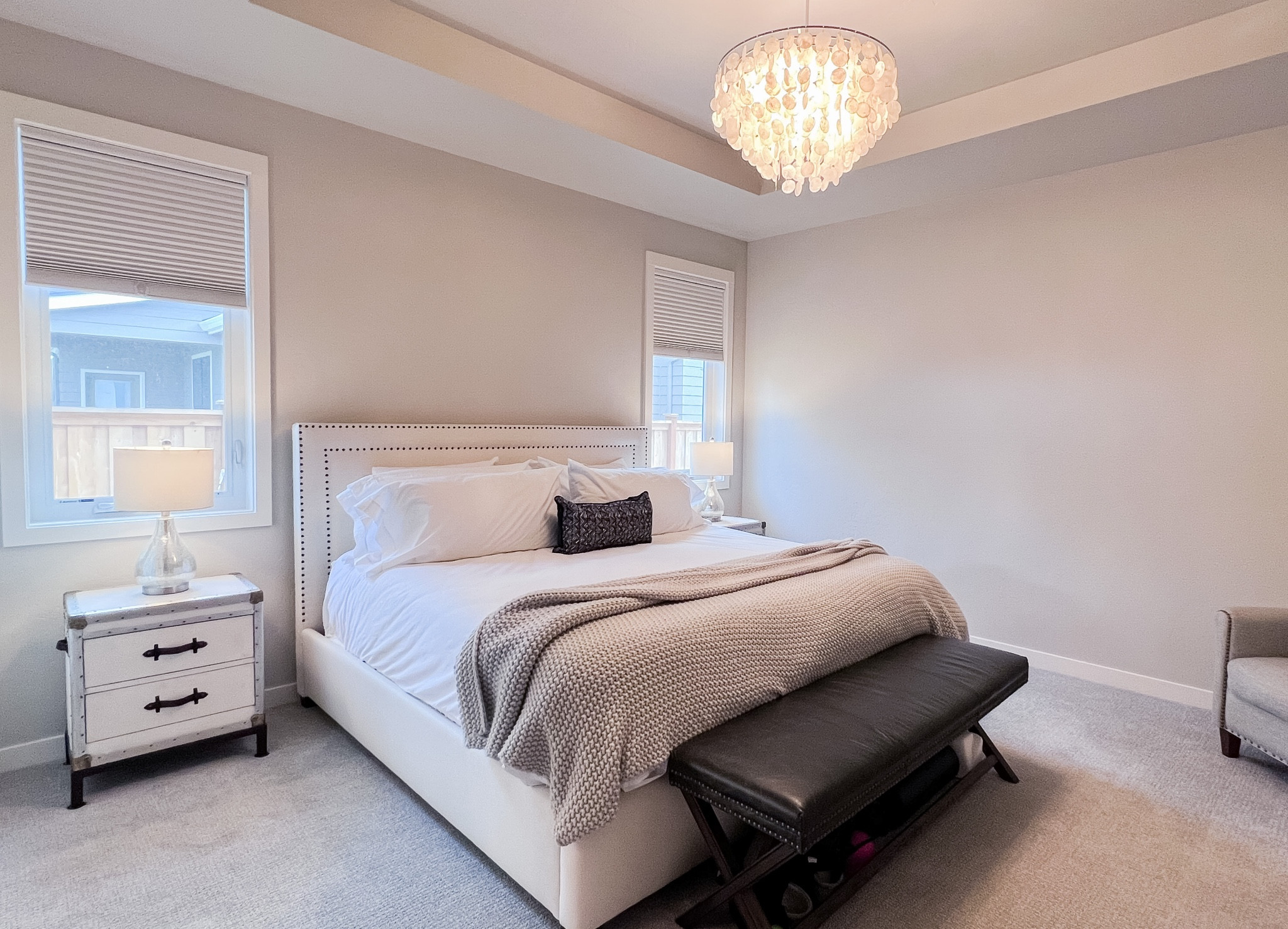 Master bedroom style. Tufted bed frame, Capiz chandelier and end of the bed leather bench. Add a throw blanket and boll & Branch sheet set.

#LTKfamily #LTKunder100 #LTKhome