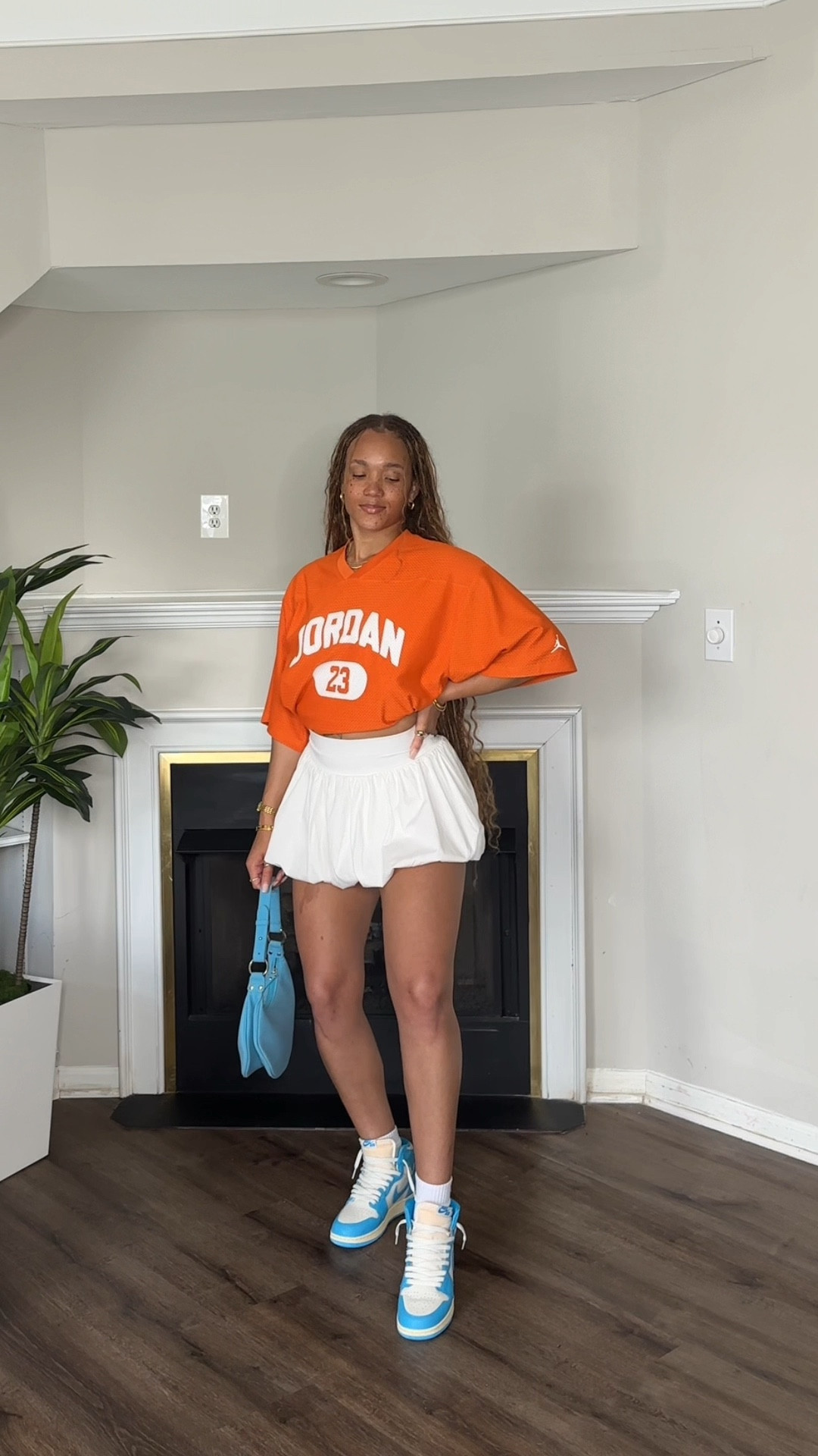 Styling my UNC Reimagined Jordan 1s with two fire fits!😮‍💨😍First, I paired them with a bold orange oversized Jordan jersey, a white bubble skirt, and a blue mini bag for a playful, game-day vibe. 

Second look: a white crop top, pleated orange mini skirt, and denim bucket hat + matching denim bag for a sporty streetwear twist. Both looks keep the sneakers the star while showing how easy it is to style Jordans with skirts for a girly yet athletic aesthetic. 🧡💙

#LTKStyleTip #LTKShoeCrush