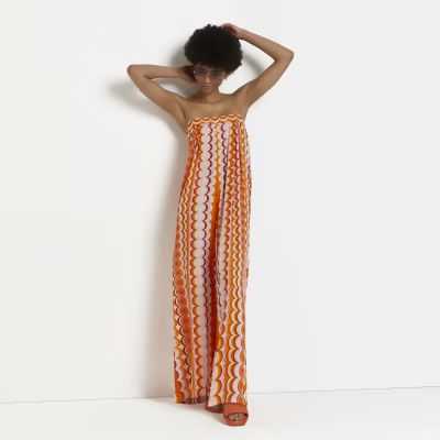 Orange printed bandeau tie back jumpsuit | River Island (UK & IE)