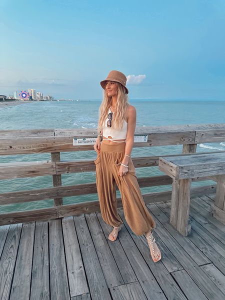 Easy Vacay Look 💛 

Pants (size XS), FP sandals, QUAY sunnies, lack of color hat, and similar white tank linked!

#LTKtravel #LTKstyletip #LTKunder50