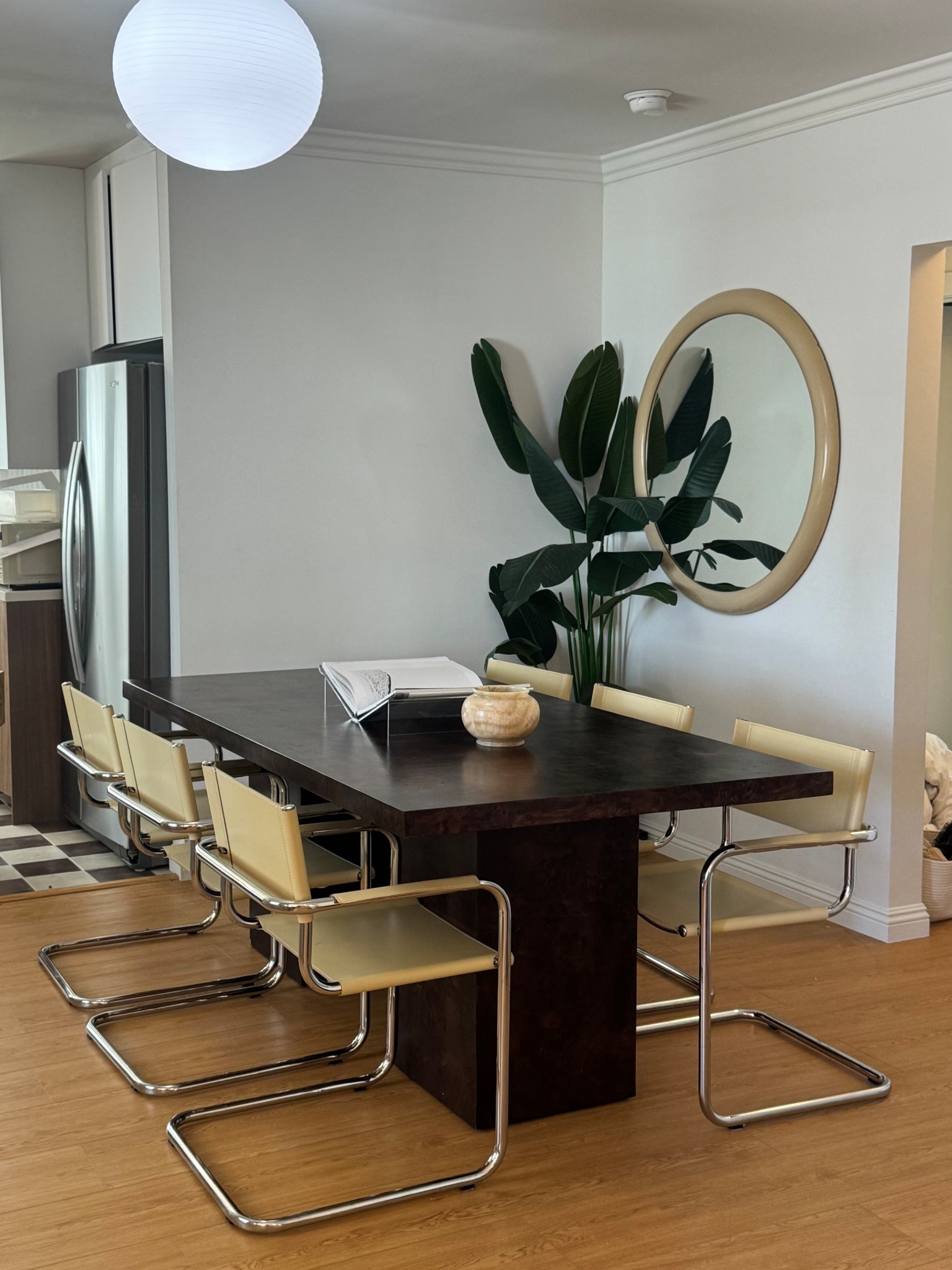 My dining room at my new house. Cozy mid century modern luxe vibes with the cream chrome dining arm chairs and the aged mahogany burl wood dining table. 

#LTKStyleTip #LTKSaleAlert #LTKHome