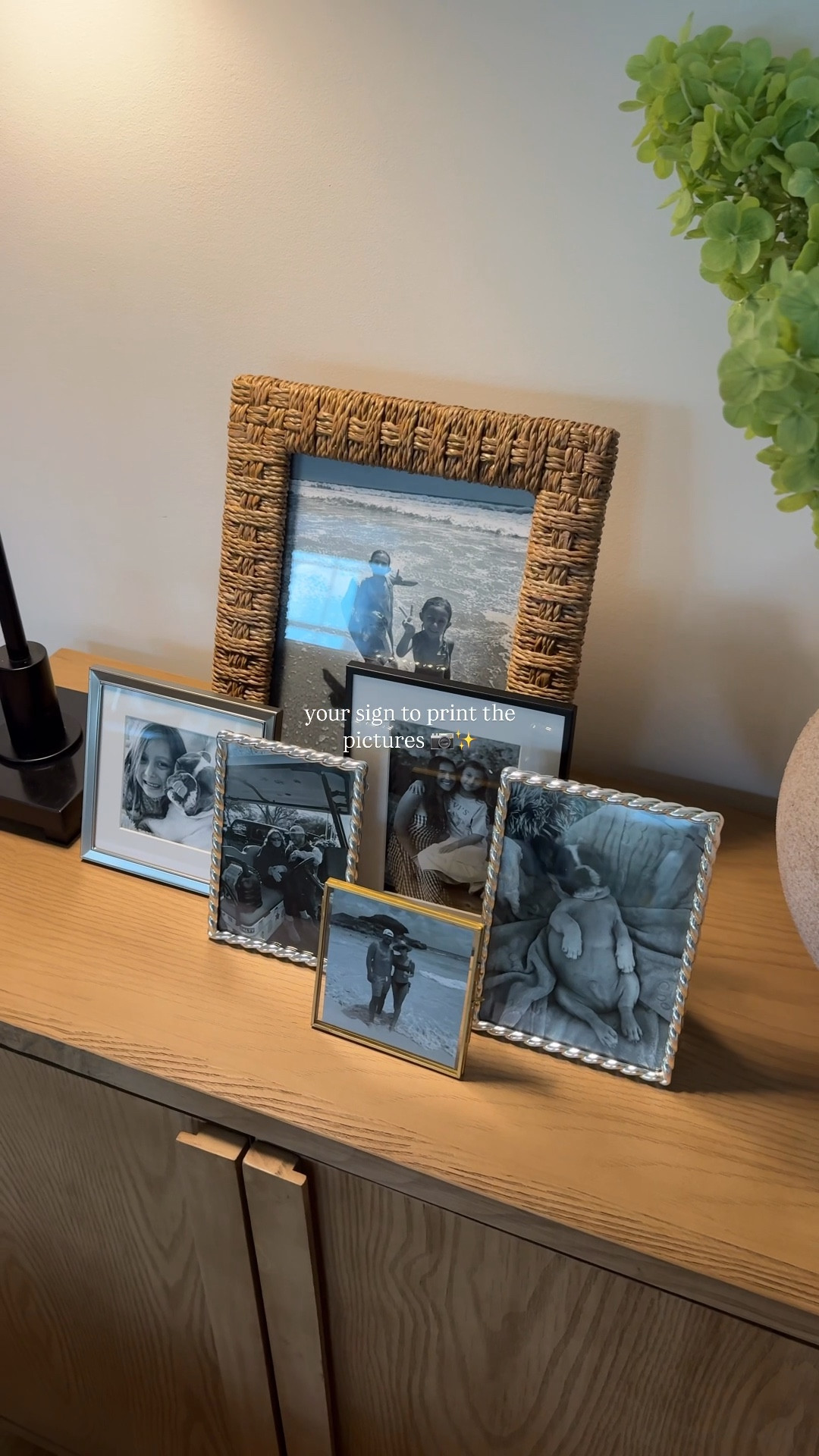 print the pictures 🖤 | this little group of memories is the sweetest addition to our new living room set up (mirror for above coming soon) -I love the layered look + it’s been such a great conversation starter ✨ 

-cabinet, florals + lamps are all recent @homegoods finds

#livingroomideas #pictureframes #homegoodsfinds #livingroominspo #livingroomdecor 

#LTKSeasonal #LTKHome