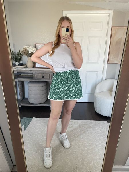 $35 Old Navy Extra High-Waisted PowerSoft Skort (size up if in between sizes, built in biker shorts underneath!!!) love the green floral print so girly!! Tank top runs big, wearing size small from Walmart 

#LTKFindsUnder50 #LTKFitness #LTKMidsize