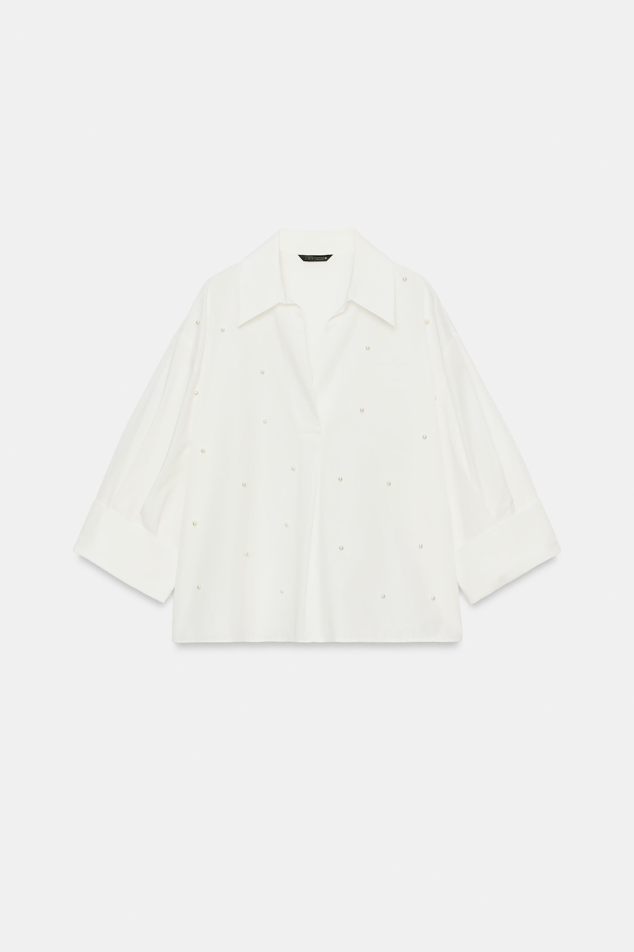 Lapel collar shirt with a V-neckline and below-the-elbow sleeves with cuffed hems. Features pearl... | Zara US