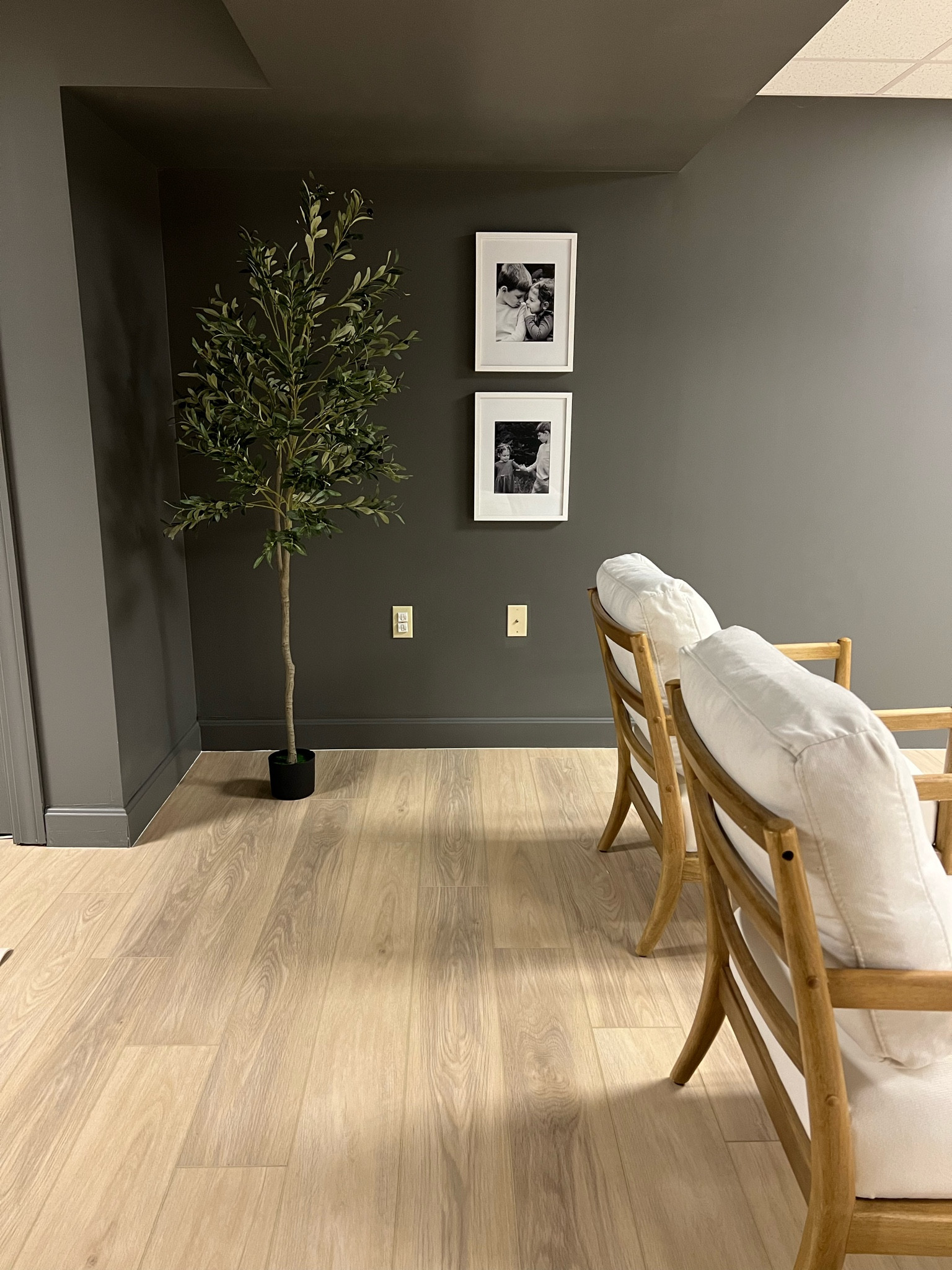 Basement, moody paint, man cave, LVP, luxury vinyl plank, oak, floors, olive tree, rustic, modern, masculine, black, picture frame, 

#LTKunder50 #LTKstyletip #LTKhome