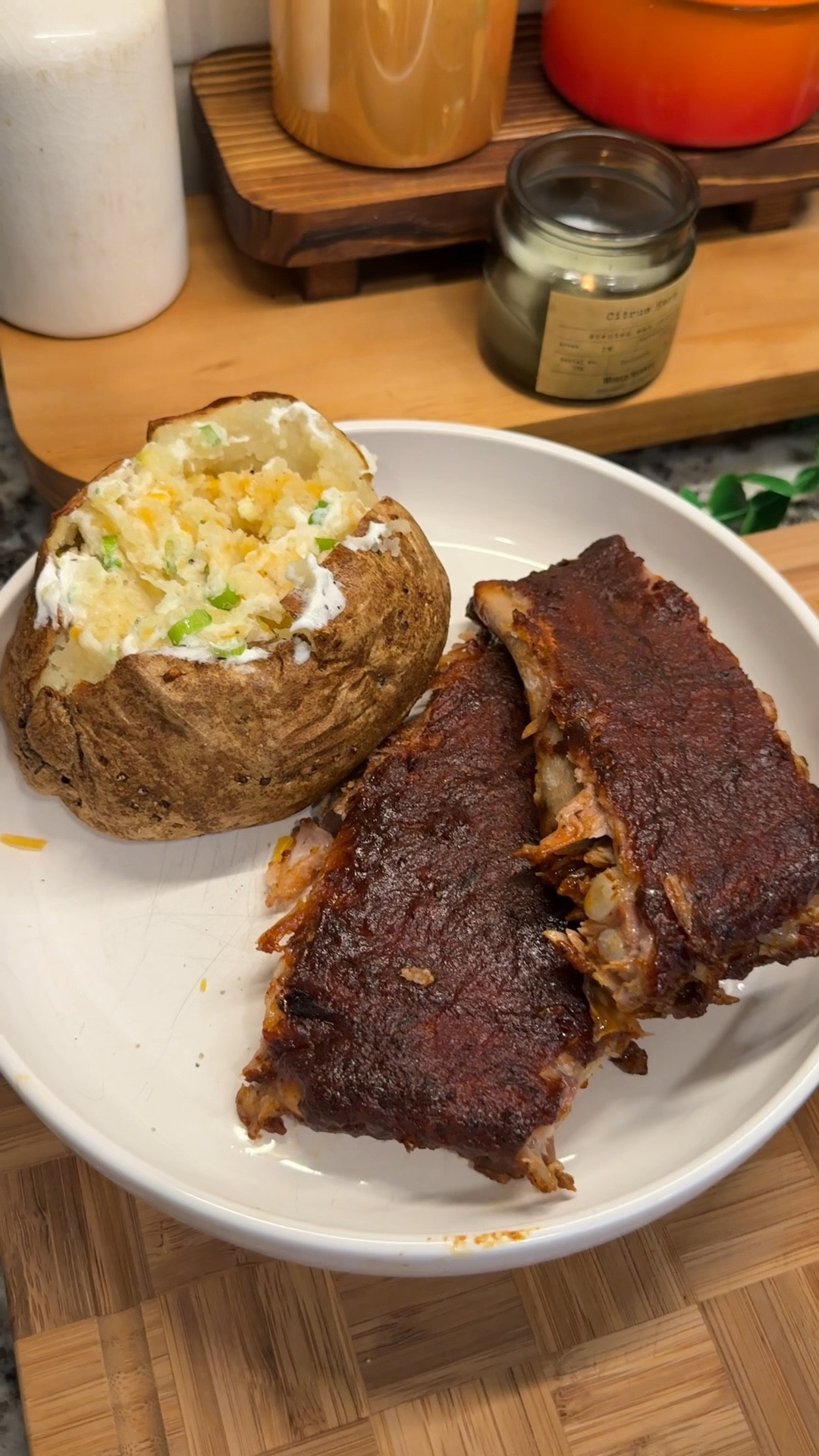 oven-baked ribs are on the menu for dinner tonight! falling off the bone & oh so tender🦴✨🔥the easiest way to make ribs without the hassle of a grill!

#ovenbakedribs #easydinnerideas #kitchenfavorites #chefgiftguide #cookingessentials

Ingredients:
- 1 rack of pork ribs (pat dry & remove membrane)
- avocado oil spray
- 1/4 cup brown sugar
- 2 tbsp smoked paprika
- 1 tbsp onion powder
- 1 tbsp garlic powder
- 1 tsp celery salt
- 2 tsp ground mustard
- 1 tsp cinnamon
- 1/2 tsp cayenne pepper
- 2 tsp salt
- 2 tsp pepper
*Bake at 275°F for 3.5 hours, remove and brush on:
- 1 cup bbq sauce
*Bake at 450°F for 5-7 minutes until sauce is carmelized

Potato:
- 2 russet potatoes (scrubbed)
- 1 tbsp olive oil
- 1 tsp salt
- 1 tsp pepper
*Bake at 425°F for 1 hour
- 4 tbsp butter
- salt & pepper to taste
- 1/3 cup shredded cheddar cheese
- 2 tbsp sour cream
- chopped green onions

#LTKHome #LTKSummerEdit #LTKFamily