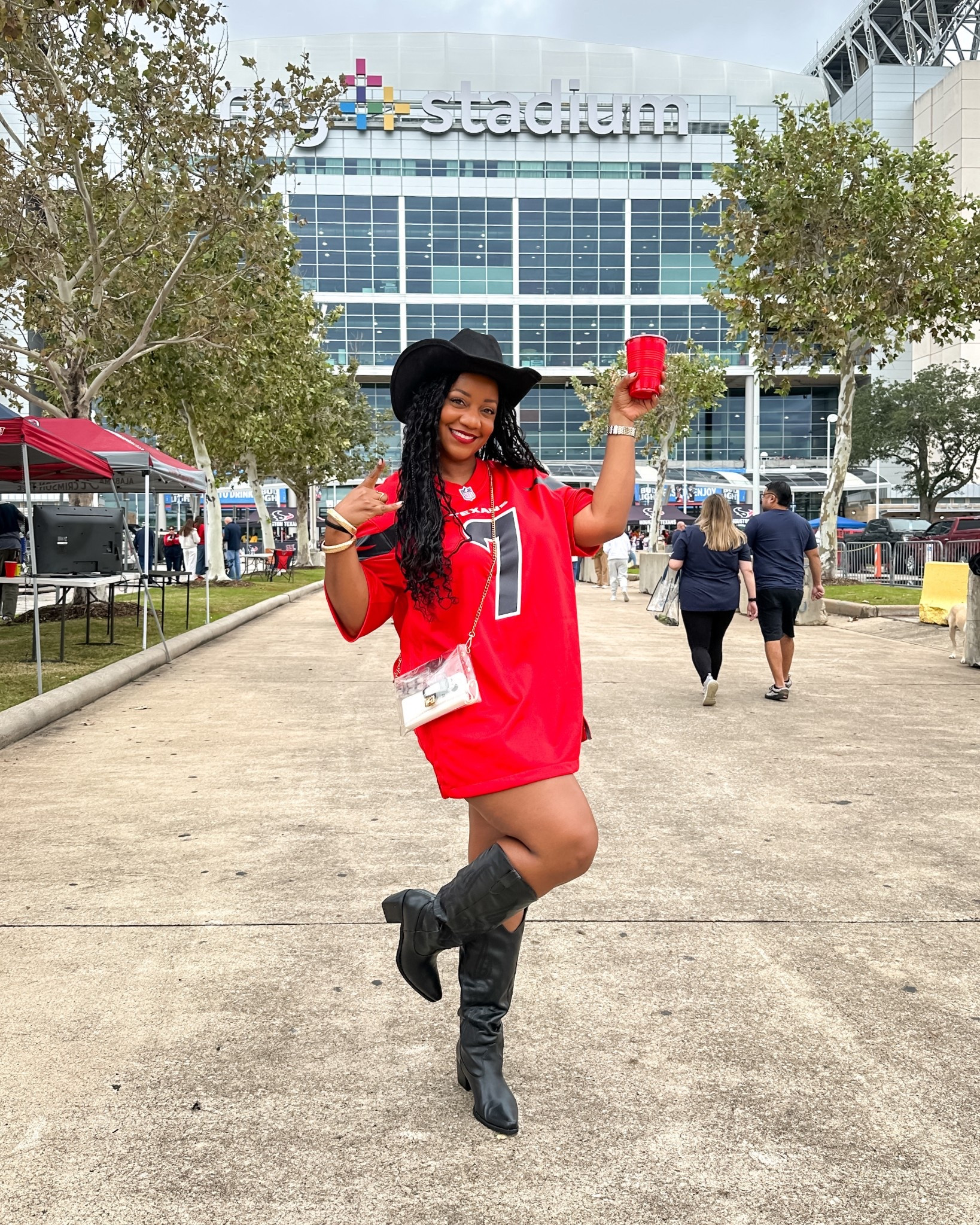 Game day ready! 🏈 Wearing my brother’s Texans jersey (men’s XL) over some shorts and paired it with cowboy boots and my favorite clear crossbody bag (stadium-approved!). Casual, comfy, and still cute for cheering on the team.🤘🏾

game day outfit / Texans game outfit / NFL game day style / sporty chic look / denim shorts outfit / casual outfit with sneakers / oversized football jersey outfit / stadium clear bag outfit / game day fashion / football game outfit / tailgate outfit ideas / cute game day outfit with sleeves

#LTKStyleTip #LTKSeasonal #LTKMidsize