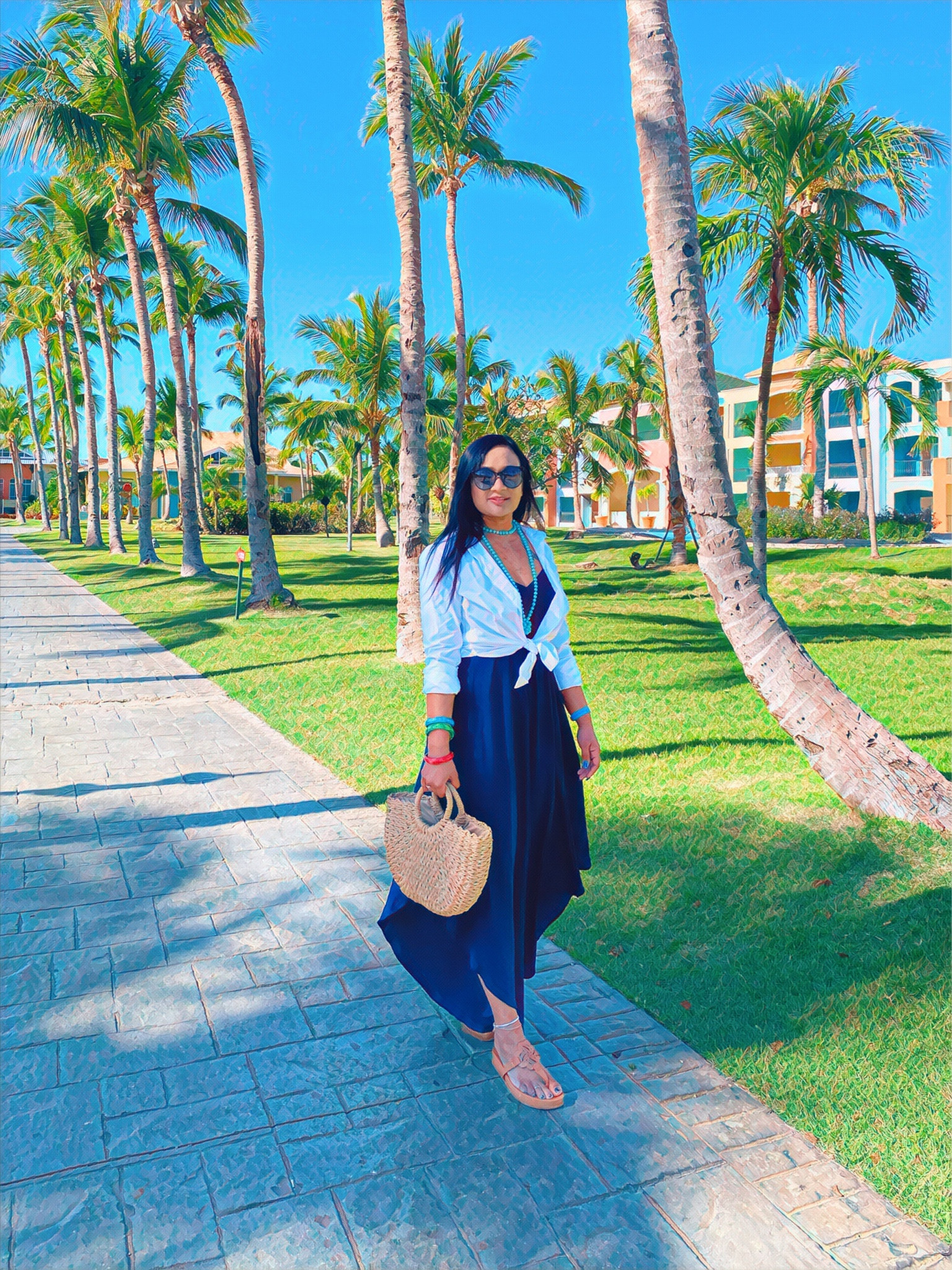 A beach vacation outfit. 
Oversized jumpsuit, button down shirt, straw bag, sandals, bead necklace 

#LTKunder100 #LTKtravel #LTKstyletip