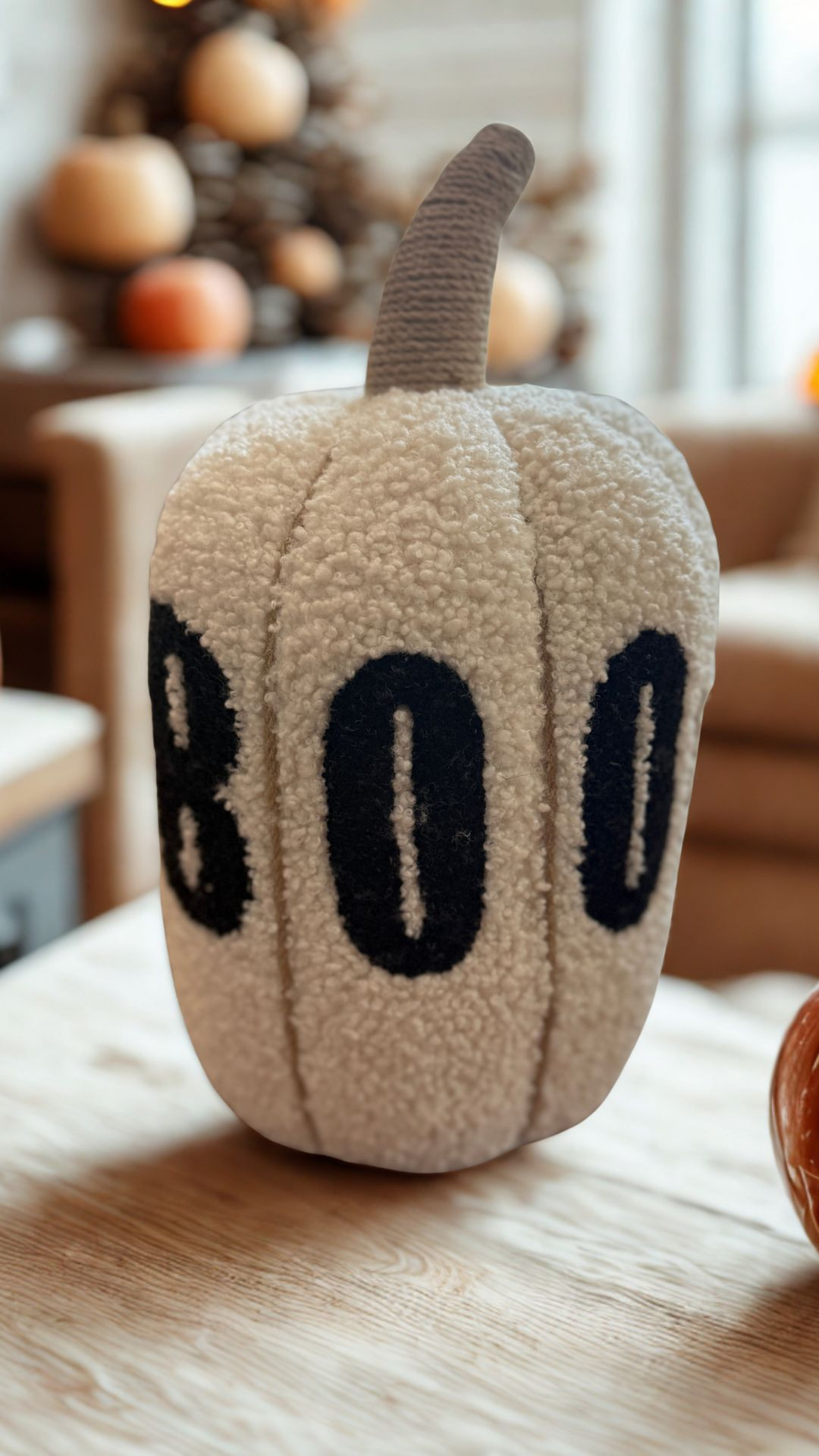 Meet the coziest scare you’ll ever invite to your couch. This plush pumpkin pillow brings just the right amount of spooky with its hand-embroidered “Boo” and wrapped jute stem, all nestled into ultra-soft faux fur. It’s the kind of throw pillow that makes your whole room feel like a warm fall hug — while still whispering Halloween mischief. Customers love how it instantly elevates their seasonal décor without being over-the-top. It’s decorative, functional, and totally cuddly. Toss it on your sofa, entryway bench, or bed and let your Halloween aesthetic haunt in the best way. 

 #LTKSeasonal #LTKOver40 #LTKHome