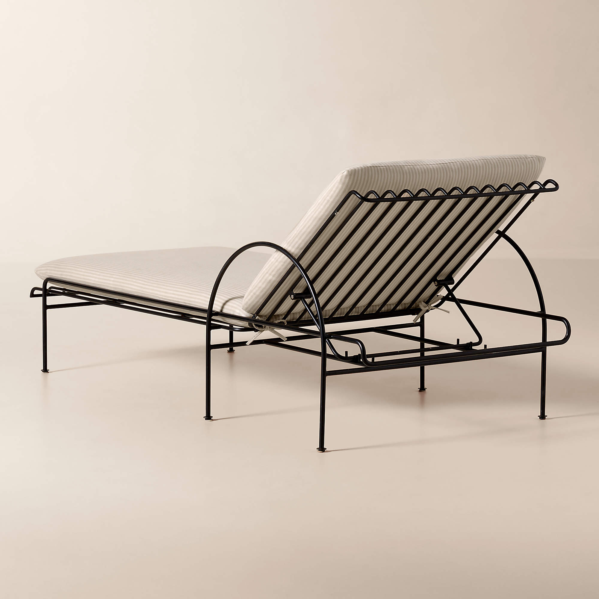 Costa Black Metal Outdoor Sun Lounger with Natural And White Striped Sunbrella Cushions | CB2 | CB2