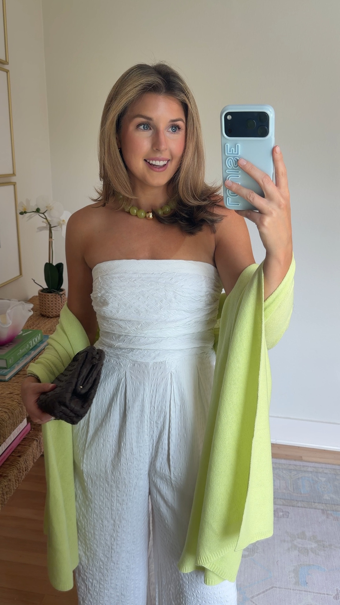 White jumpsuit for summer that is 40% off for a limited time with code: FOURTH. Wearing a S