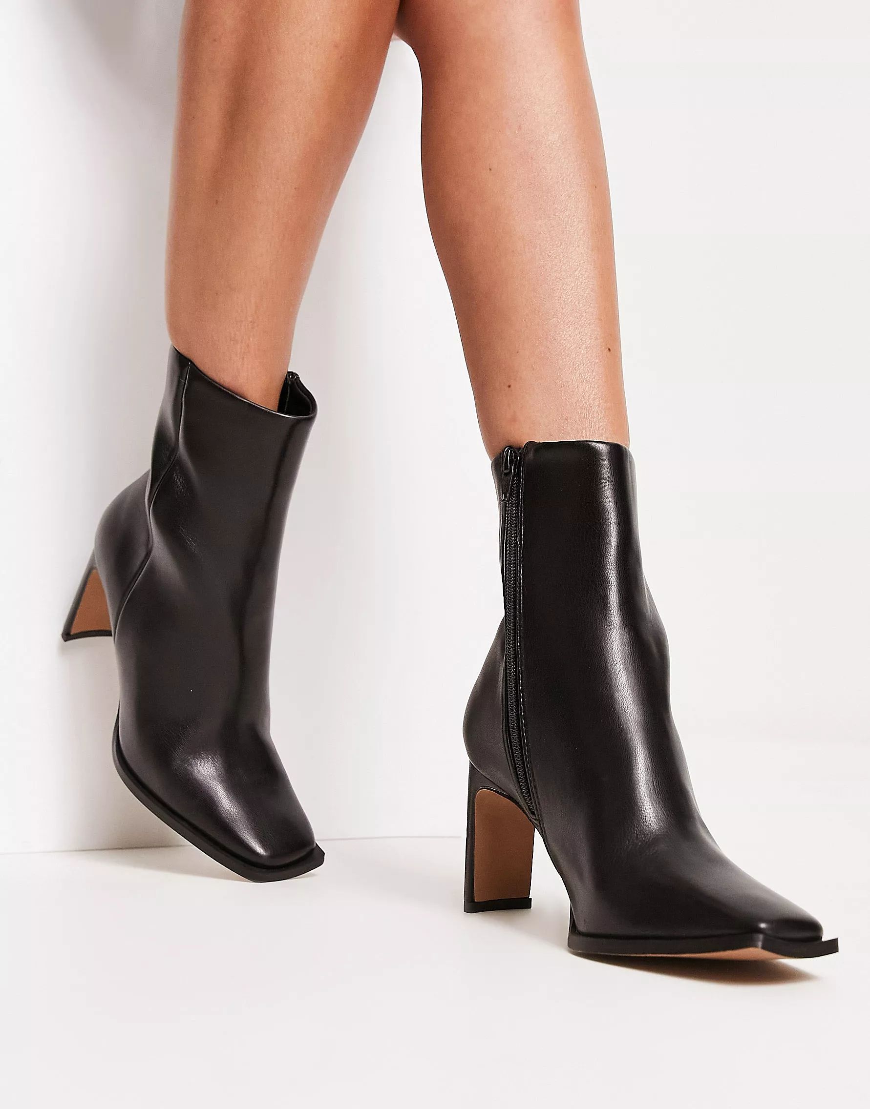 ASOS DESIGN Remmy set-back heeled boots in black | ASOS (Global)