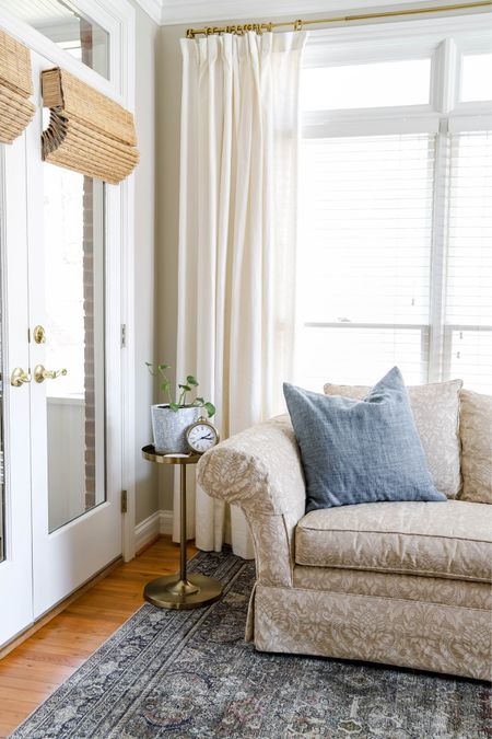 The sitting area in my bedroom features this lovely olive/charcoal rug, plant stand and linen curtains .

#LTKhome