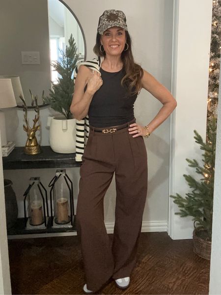 Fun fall tending fashion
Mixing black and brown with trousers, sneakers , stripped cardigan and gold accessories 

#LTKstyletip #LTKover40 #LTKSeasonal