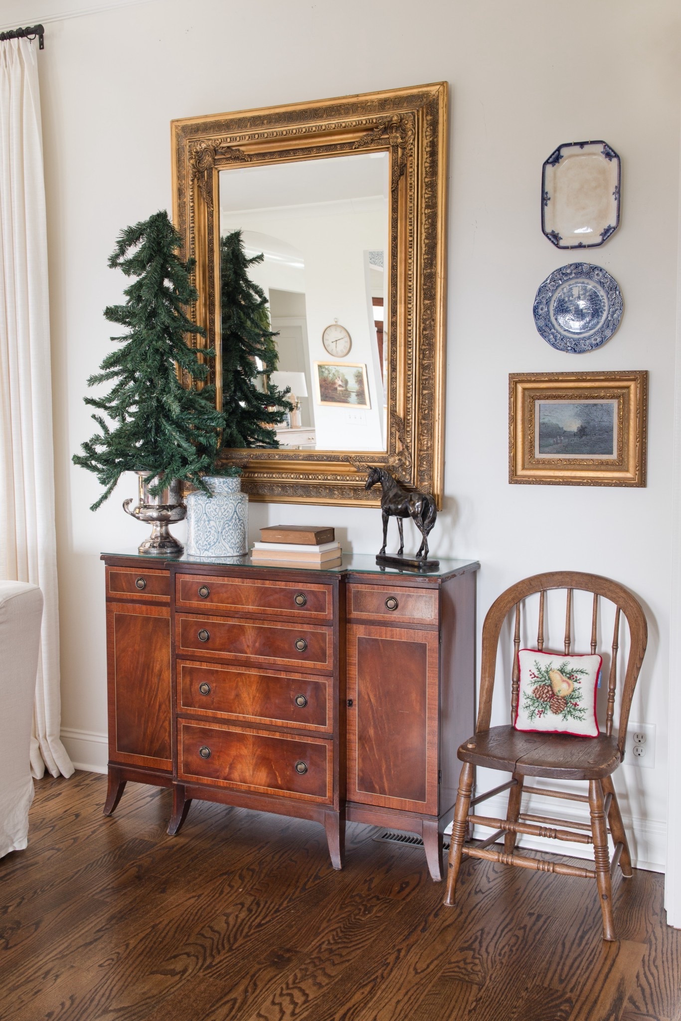 Updated wall in the living room with vintage and antique finds 

#LTKSeasonal #LTKHome #LTKHoliday