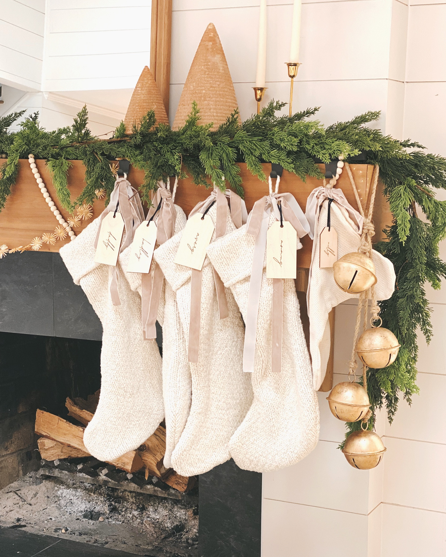 Knit Christmas stockings with a vintage look hung with velvet ribbon and gold bells 🔔 #stockings #knitstockings #mantle #decor #christmas

#LTKSeasonal #LTKHoliday #LTKhome