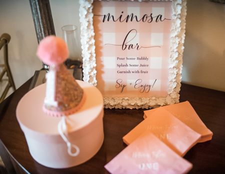 Pink gingham mimosa bar sign, white picture frame, first birthday party hat

#LTKhome