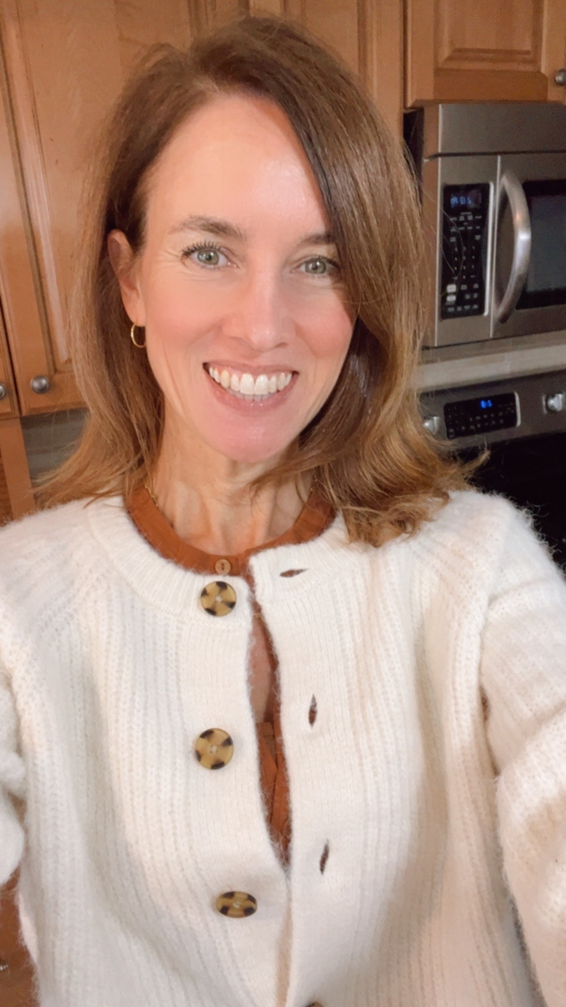 My Sweater of the Day: Best selling Abercrombie & Fitch Crew Cardigan in Off White (also in red, taupe, green, grey).  Styled with my Mother Denim Jeans, American Eagle AE Henley, and Old Navy ribbed tank.  Accessories include my BaubleBar gold hoop earrings and Gorjana chain necklace.  #sweateroftheday #OOTD #mystyle #MyOver40Style #sales #afterChristmasSales #WinterCardigan

#LTKHome #LTKdayinmylife #LTKOver40