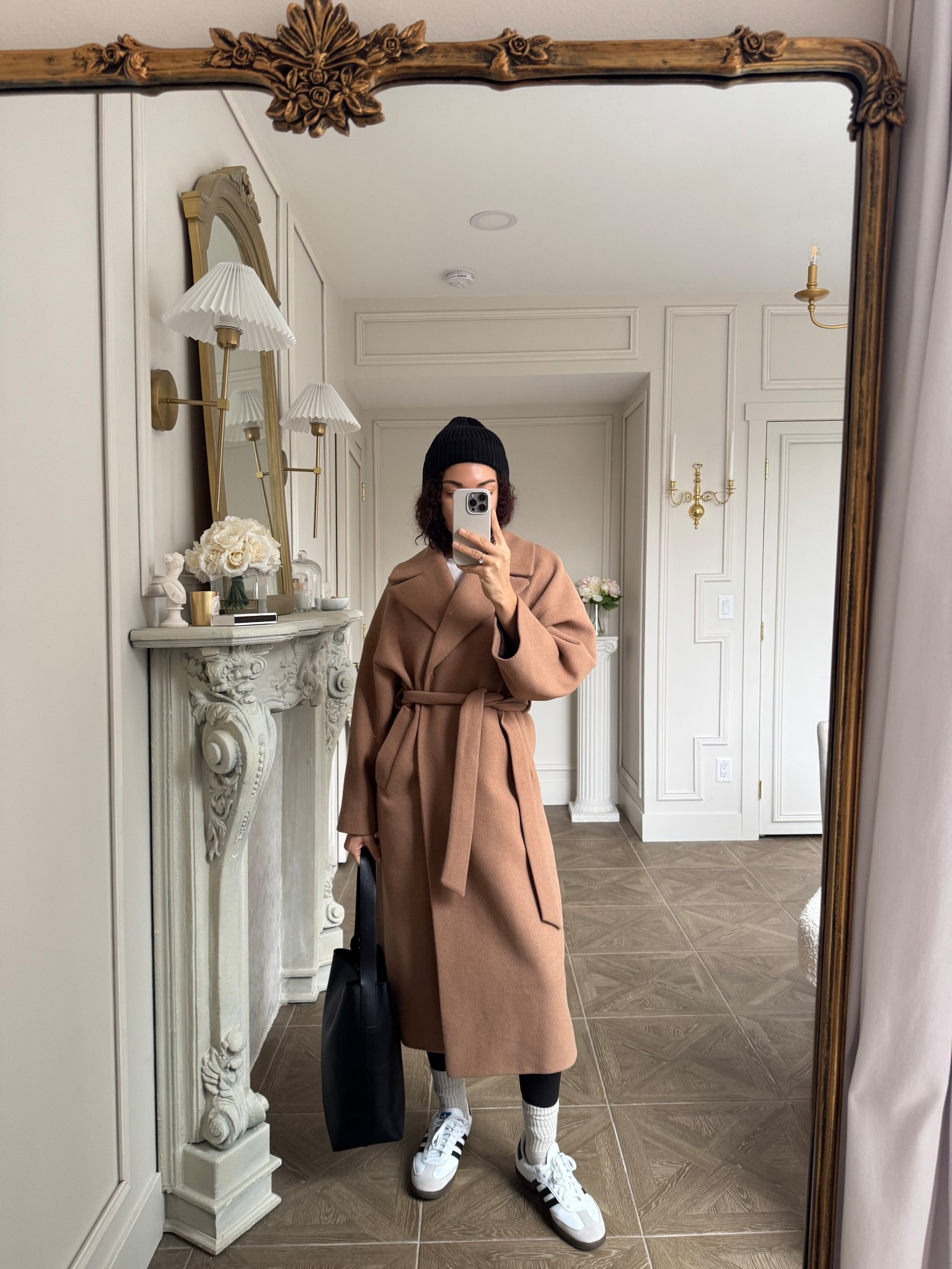 Casual chic winter outfit with leggings, sneakers, belted coat, tote bag, and beanie 

#LTKootd