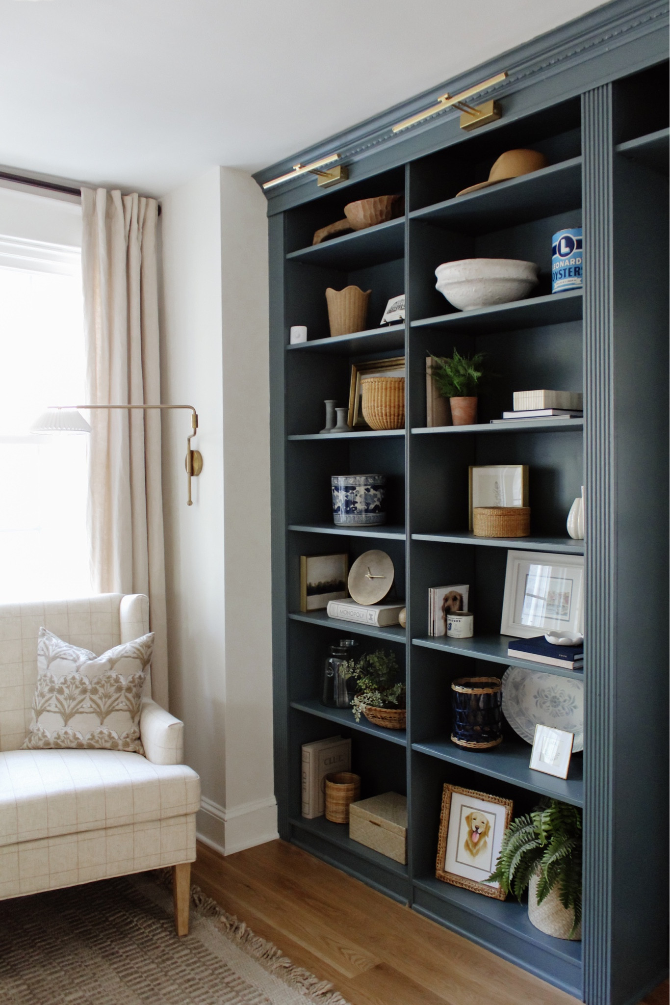 A little spring shelf refresh with high-quality stunners from @calinicoastal ✨ Browse this adorable female-founded shop for the most effortless home accents + gifts via the link in bio or from my LTK shop! #ad
•
•
•

Neutral rug, target home, Pleated wall sconce, pleated light, sitting room Gold battery operated picture lights, simple home decor, amazon home decor, simple home style Wood bowl, shelf decor, shelf design, shelf styling, decor accents, decorative objects, decorative box, lidded bin, woven basket, faux plant, paper mache bowl, target finds, home style, blue shelves   #shelfdecor #openshelves #whiteandwood #homedecor #flashesofdelight #smpliving #neutraldecor #makehomematter #makehomeyours #hygge #hyggehome #currenthomeview #bhghome #simplehomestyle #cozyhome #countrystylemag #howihaven #pocketofmyhome #interiorismo #apartmenttherapy #shelfiedecor #shelfstyle #shelfstyling #bookcasestyling #shelfiesunday #bluepaint #shelfstylingideas #shelfinspo floral pillow cover, coastal decor, coastal grandmother style, blue home decor, home gift idea

#LTKunder100 #LTKhome