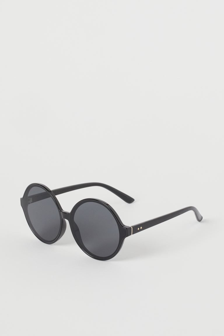 Sunglasses with round plastic frames and tinted, UV-protective lenses. | H&M (US)