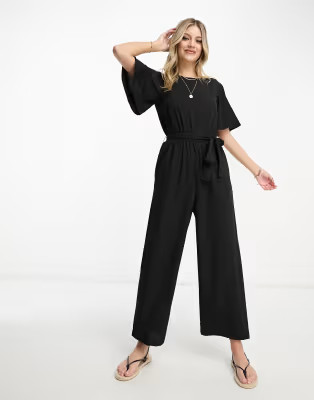 Monki flutter sleeve tie waist jumpsuit in black | ASOS (Global)