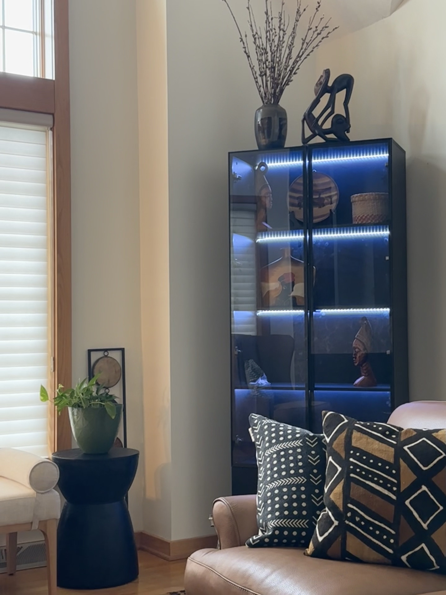 Display your favorite collections from your travels in a glass door cabinet with led lights. Style by grouping items in odd numbers, balancing height and colors. This is nothing like your grandmothers curio cabinet 😉

#LTKHome #LTKxMadewell #LTKStyleTip