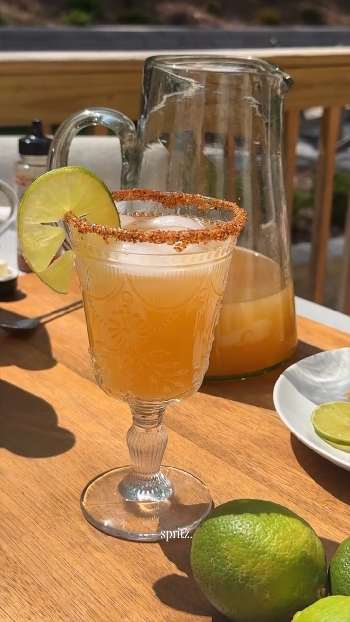 Pitcher of Apri-HOT Margarita Spritzes 🍹🍋‍🟩🍾

INGREDIENTS:
1 cup tequila blanco
1/2 cup Cointreau
1/2 cup fresh lime juice
1/2 cup apricot nectar
1/4 cup hot honey
2 cups dry sparkling wine (like Cava, Prosecco, or Brut Champagne), chilled
Chili-lime salt, lime wheels, and apricot slices (if you’re feeling extra)
Ice