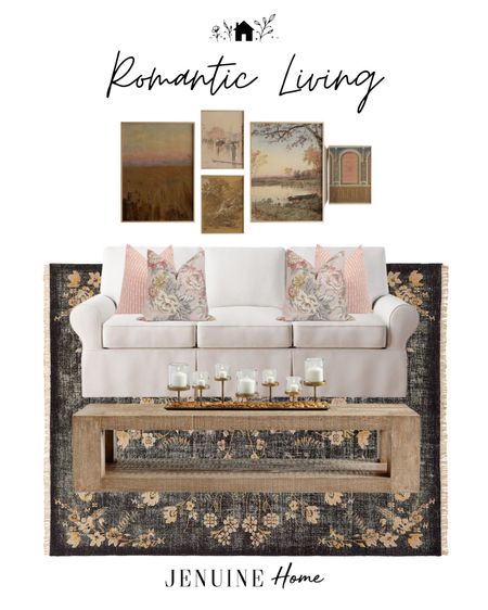 Romantic living room. Gallery wall art. Romantic art. White couch. White sofa. Pink floral throw pillow. Pink pillow with stripes. Gold candle decor. Black and floral chic rug. Wooden coffee table  