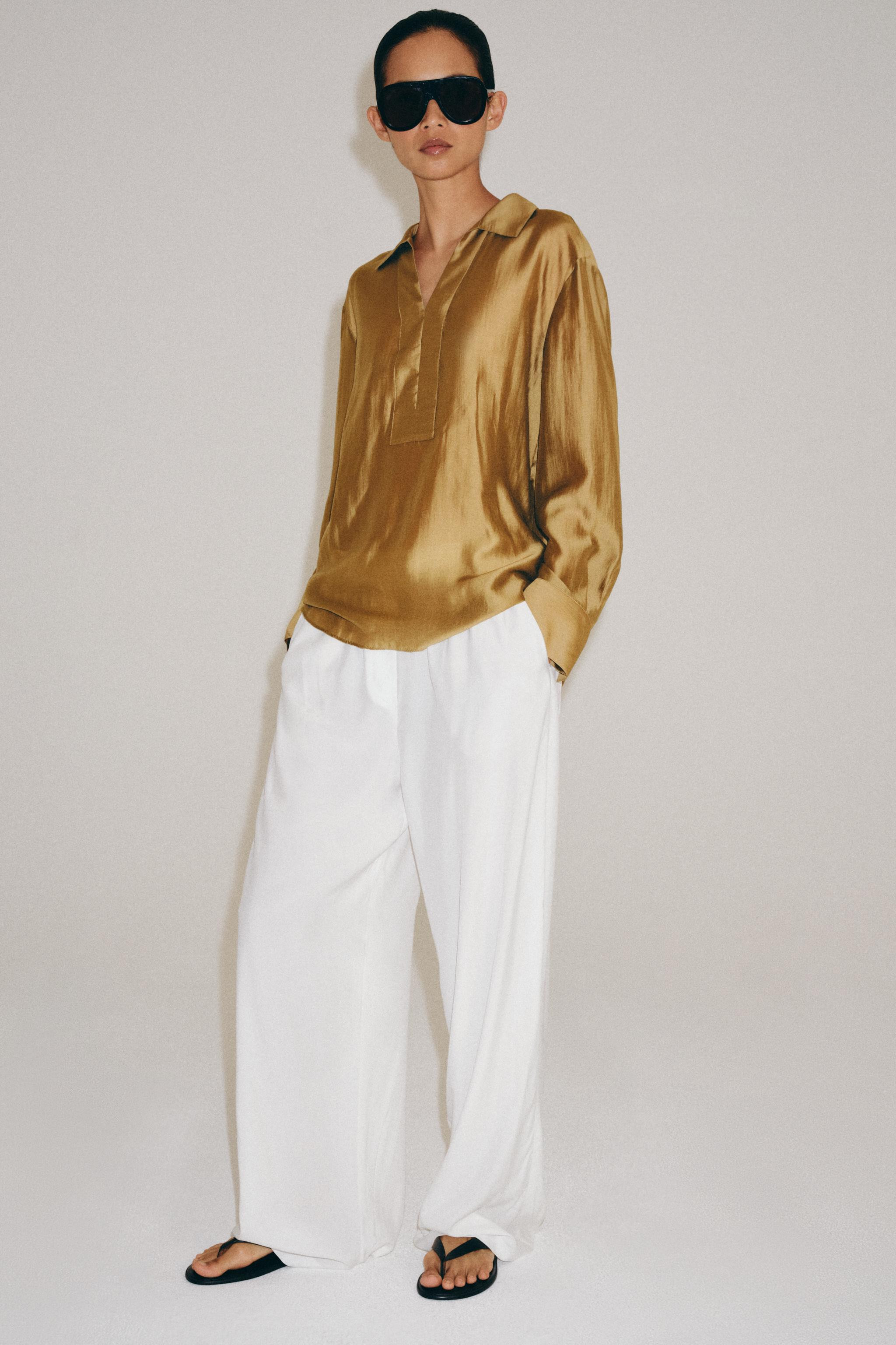 ZARA WOMAN COLLECTION. Shirt made from a lyocell blend fabric. Lapel collar and long sleeves with... | Zara US