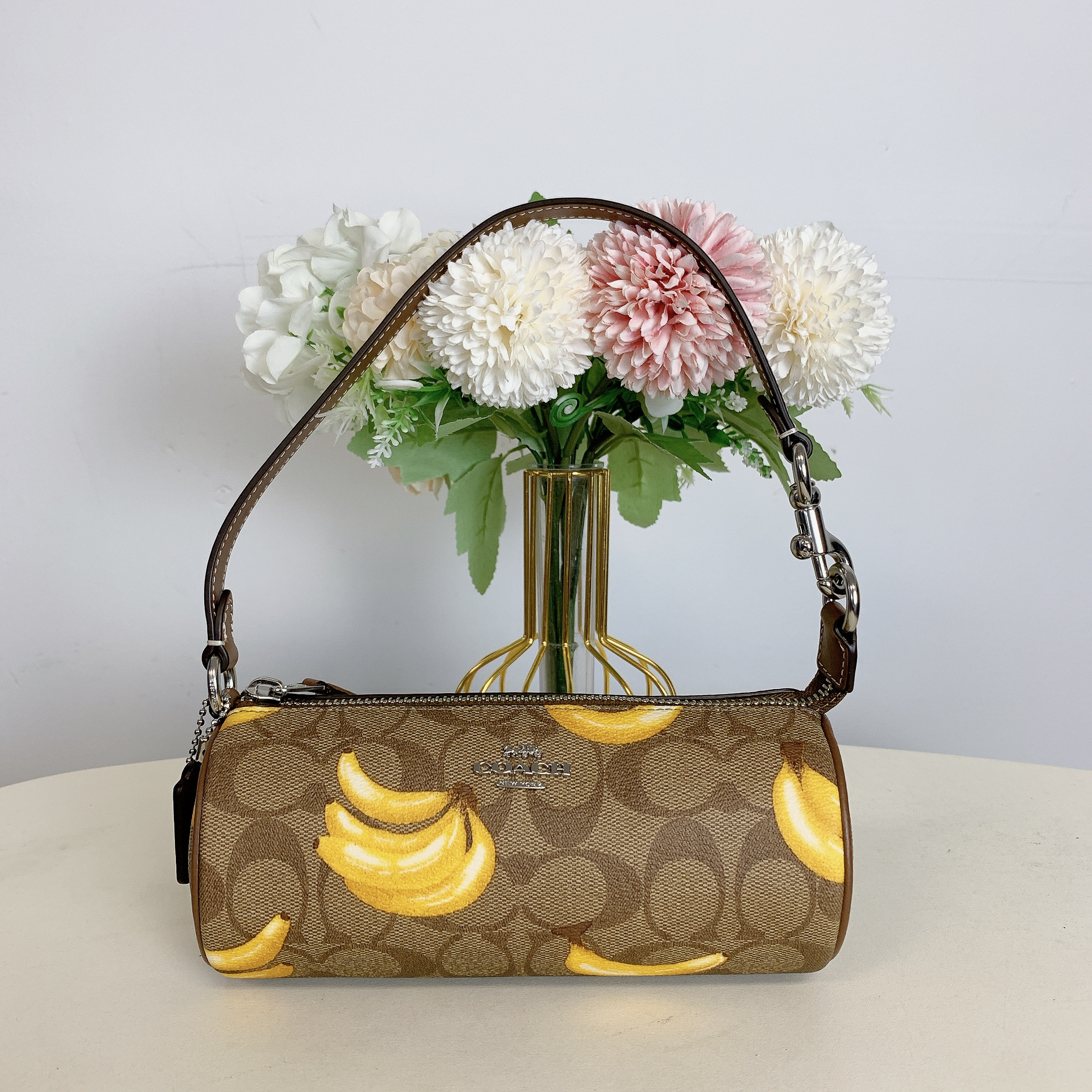 Coach Nolita Barrel Bag in Signature Canvas Banana Print (Khaki/Dark Saddle) | Walmart (US)