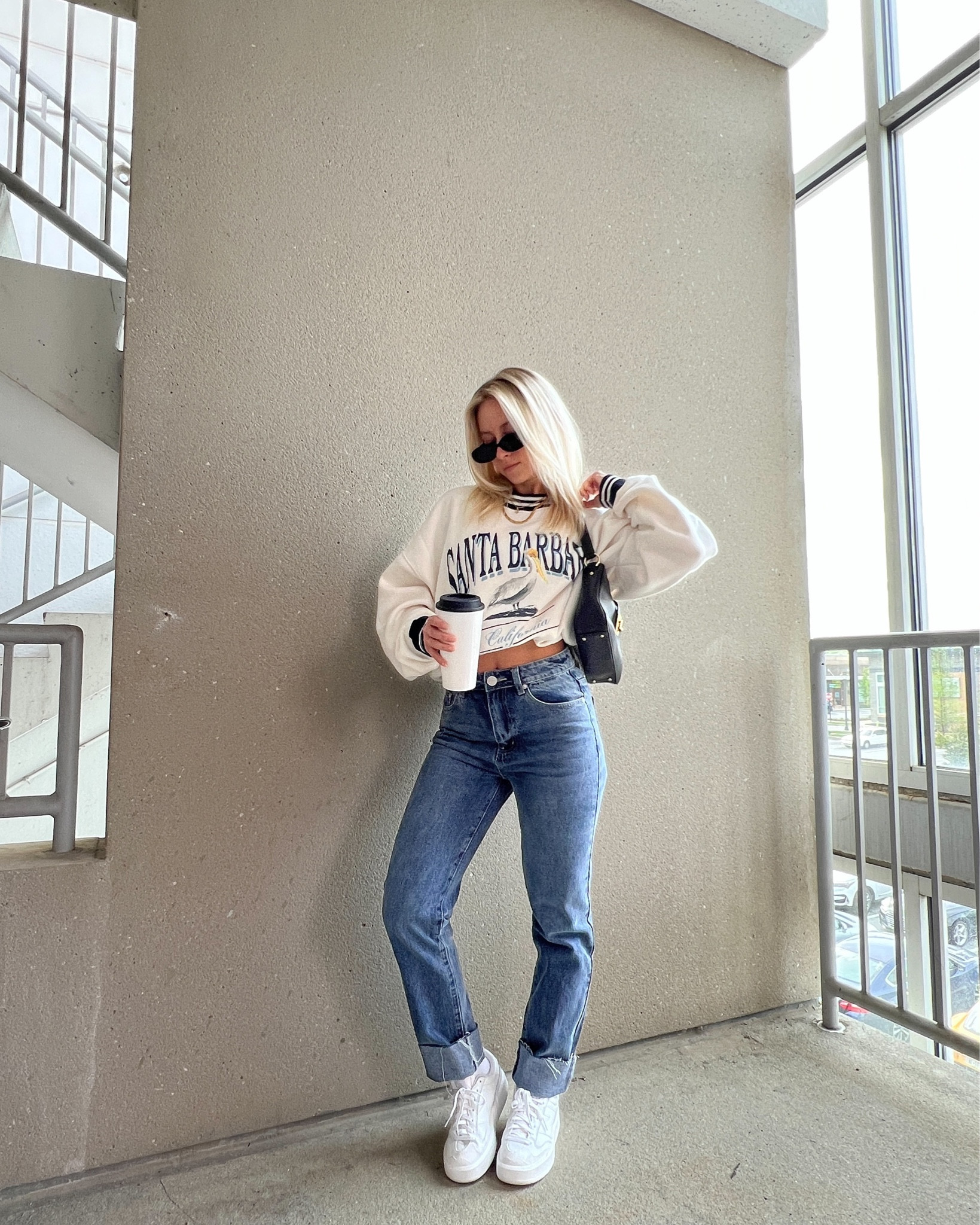 Revolve jeans, medium wash jeans, dark wash denim, oversized crewneck, neutral crewneck, oversized sweatshirt, casual spring outfits, casual outfit ideas, new balance sneakers, platform sneakers, white new balance sneakers, new balance CT302 sneakers