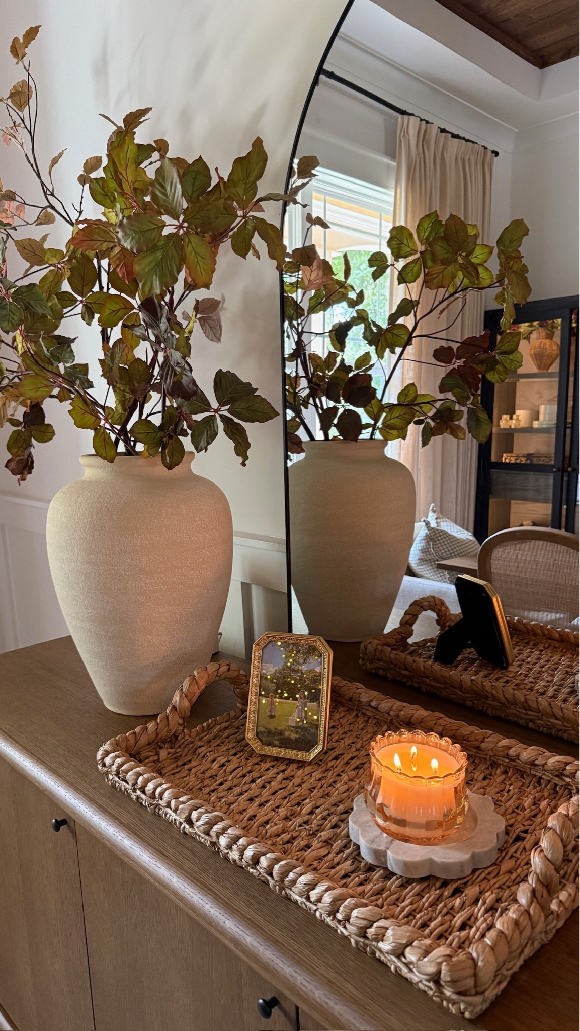 A magical corner in our dining room 🍁 We styled our buffet sideboard table for fall with seasonal stems, candles, and pretty textures.

#LTKHome #LTKSeasonal