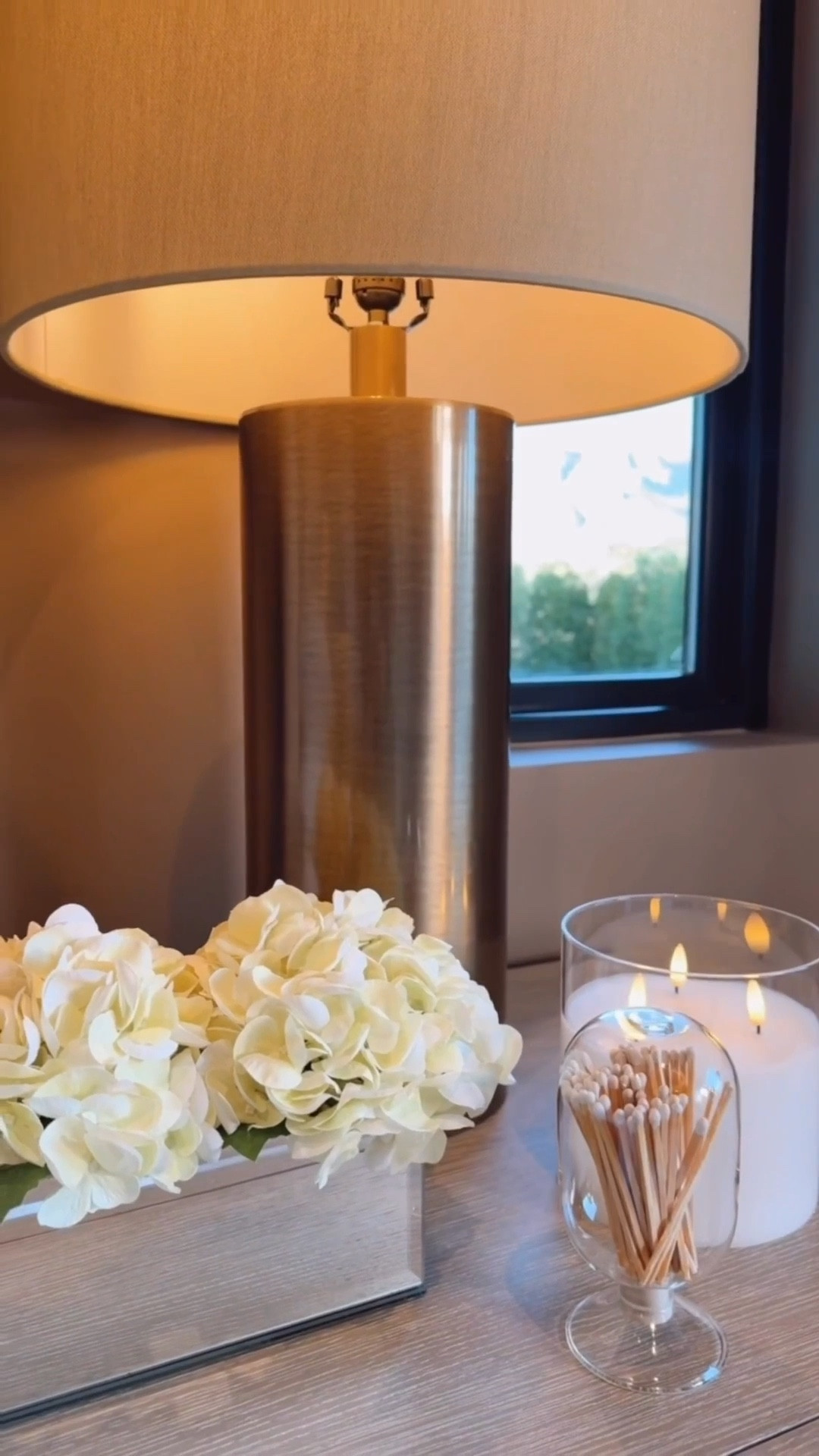 A simple and stylish side table setup featuring white flowers, decorative matches, a flameless candle, and a cozy lamp. The perfect mix of minimal decor and warm ambiance.


#sidetabledecor #homedecor #minimalistdecor #cozyhome #interiordesign #neutralhomedecor #homestyling #decorinspo


#LTKHome #LTKselfcare #LTKdayinmylife
