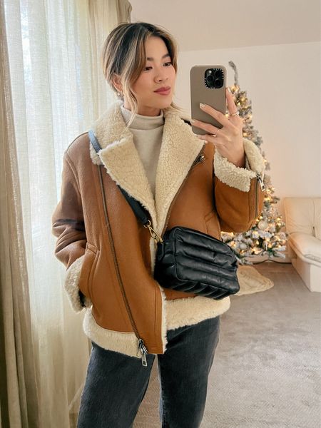 A cream mock neck sweater under a Madewell oversized shearling-lined brown moto jacket and black denim with Free people black western booties!
 
Top: XXS/XS
Bottoms: 00/0
Shoes: 6

#winter
#winteroutfits
#winterfashion
#winterstyle
#holiday
#giftsforher
#lululemon
#freepeople 
#madewell


#LTKstyletip #LTKHoliday #LTKSeasonal