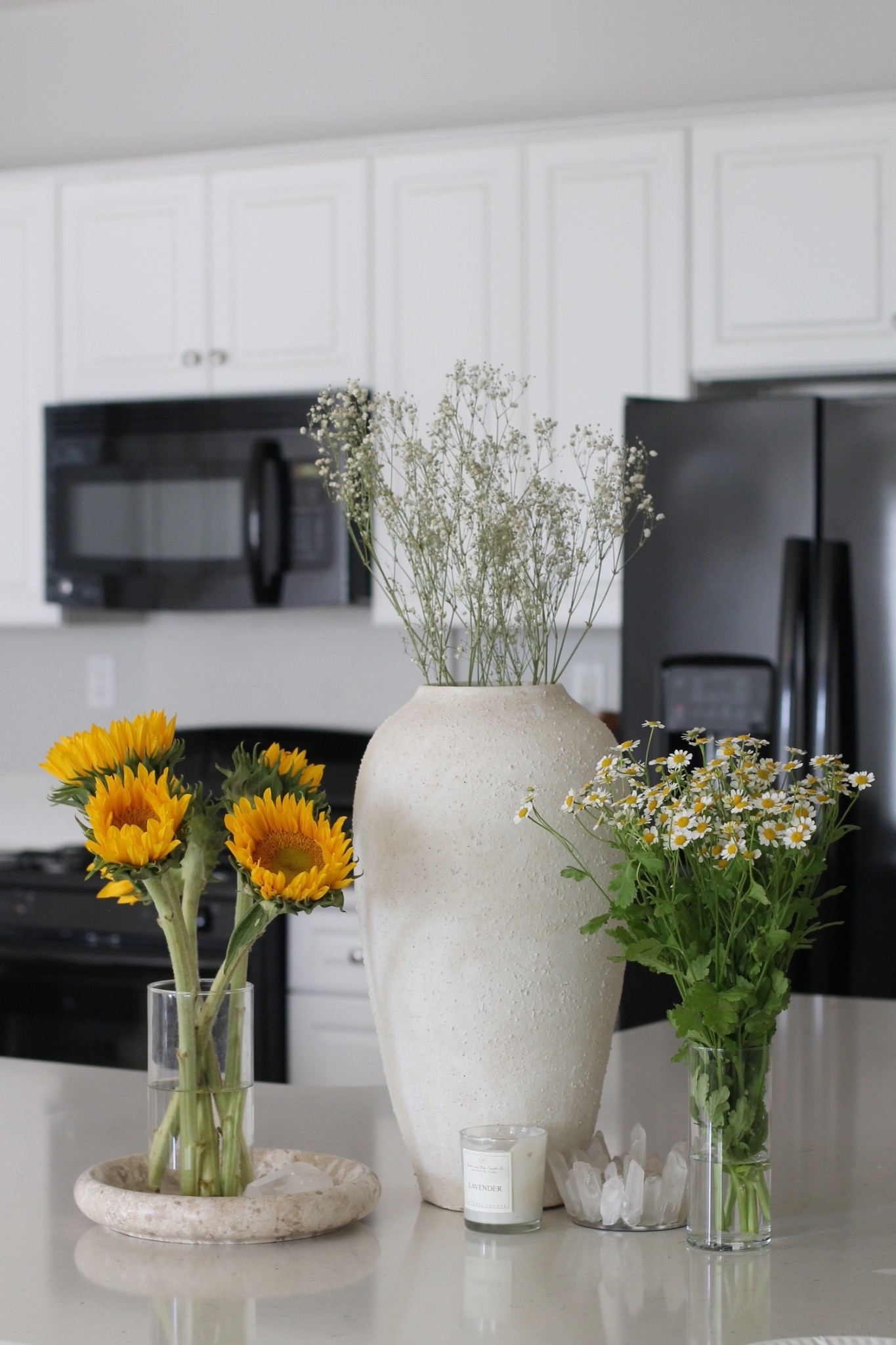 Spring kitchen island decorating
Cb2 white vase
Spring flowers 
Bouquet 
Quartz Crystal and candles
White kitchen 
Organic modern home decor 

#LTKHome #LTKSpringSale #LTKSeasonal