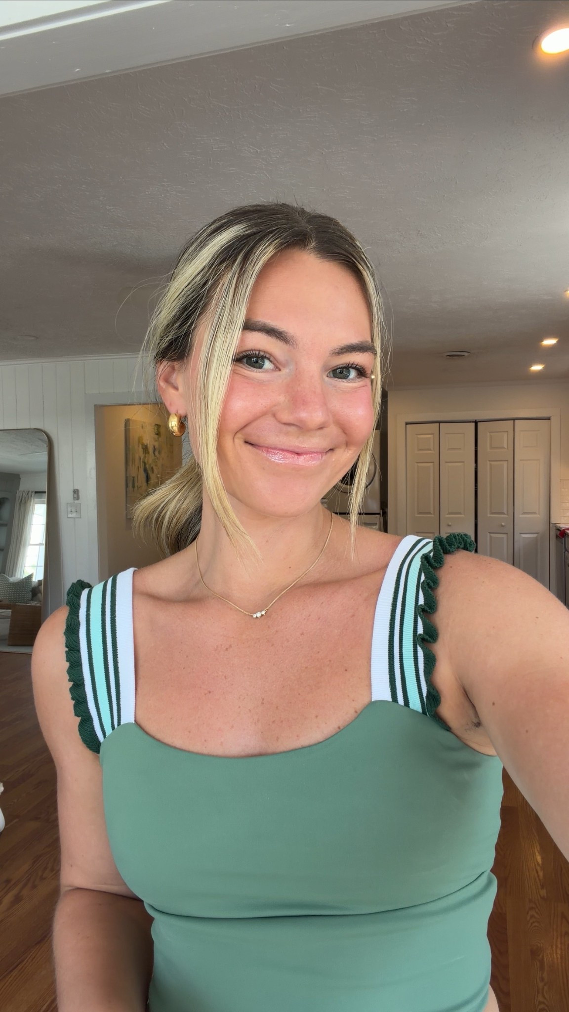 Current favorite workout tank 💚 The fit is so flattering and the details make it feel elevated compared to a basic gym top. Perfect for workouts, walks, or errands after. Wearing size M. #ltkfit #workouttop #activewearstyle #gymlook 

#LTKgrwm #LTKdayinmylife #LTKootd