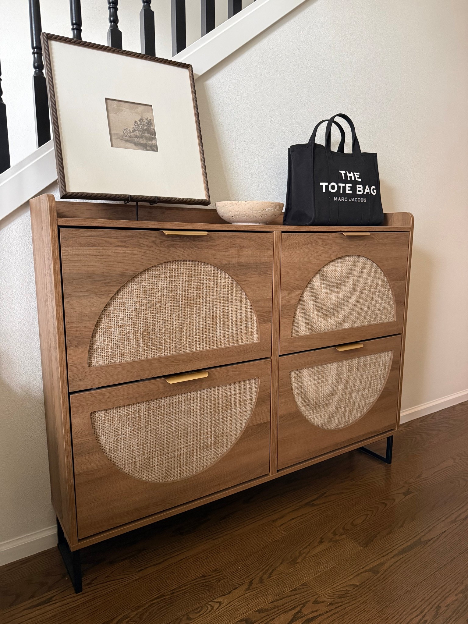 This viral shoe cabinet was truly the best change I made to my small entryway. If you are dealing with a tight floor plan, you know that every inch counts. What makes this piece a total game changer is the ultra narrow design. It is significantly slimmer than the average shoe cabinet, allowing it to fit into those awkward, small areas without blocking the flow of the room.
It instantly made my home feel more beautiful, functional, and way less messy by keeping shoes tucked away and out of sight. 

My favorite part is the top surface, which provides the perfect spot for some intentional decor to make the space feel curated and lived in.

Design Features:
• Ultra Slim Profile: Perfect for narrow hallways and small entryways.
• Hidden Storage: Keeps clutter at bay for a clean, minimalist look.
• Decor Friendly: A sturdy top shelf for lamps, vases, or catchall trays.
• Modern Aesthetic: Elevates the home you have with a high end feel.

#LTKHome #LTKmomlife