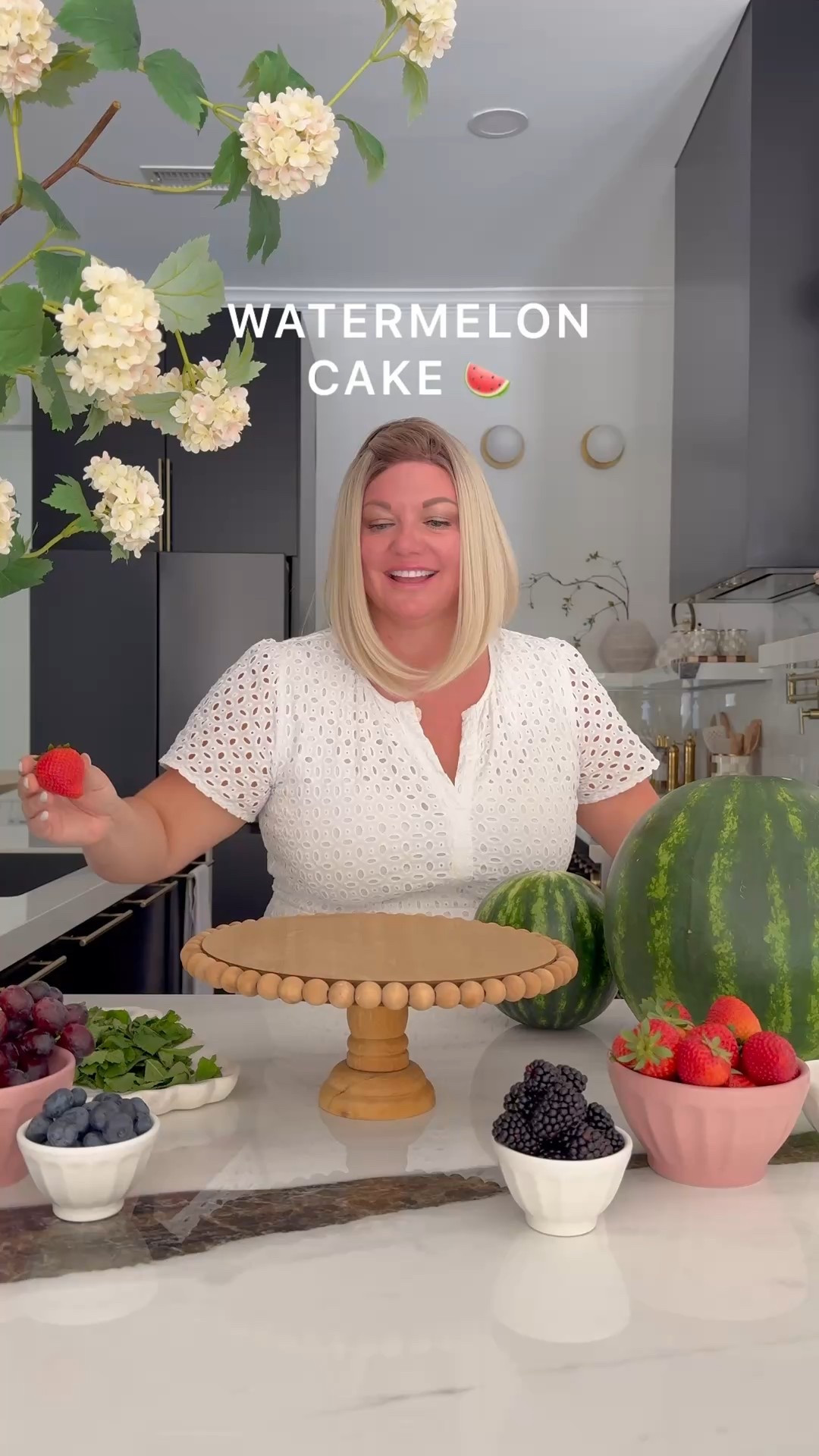 A watermelon cake is a refreshing, healthy summer treat made entirely from fresh fruit. Here's a quick guide to create a three-layer watermelon cake with berries, mint, and grapes.
Ingredients:
1 large seedless watermelon
1 pint strawberries
1 pint blueberries
1 pint blackberries 
1 bunch grapes
Fresh mint leaves
Toothpicks & Skewers 

Instructions:
Prepare the Watermelon:
Cut off both ends of the watermelon for stability and remove the rind to form a smooth cylinder. Slice into three thick discs.
Assemble the Cake:
Stack the discs from largest to smallest on a platter, securing with skewers.
Decorate:
Wash and prepare the berries and grapes; arrange them on the cake for a cascading effect.
Garnish with Mint:
Add mint leaves for a fresh aroma.
Serve:
Chill until serving. Slice and enjoy!

#LTKHome #LTKFamily