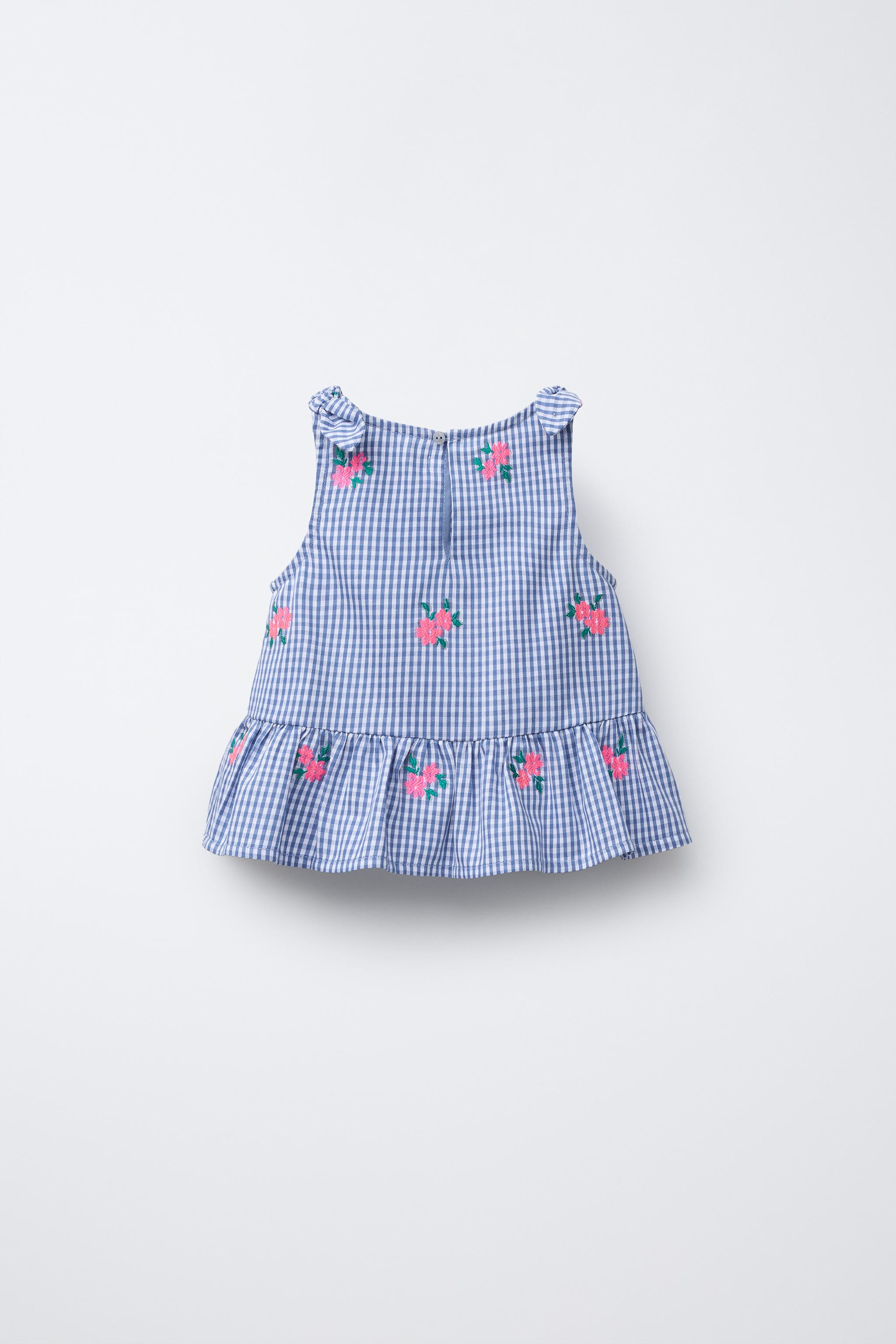Shirt with round neck and straps with bow appliqué. Teardrop button closure at back and ruffled ... | Zara US