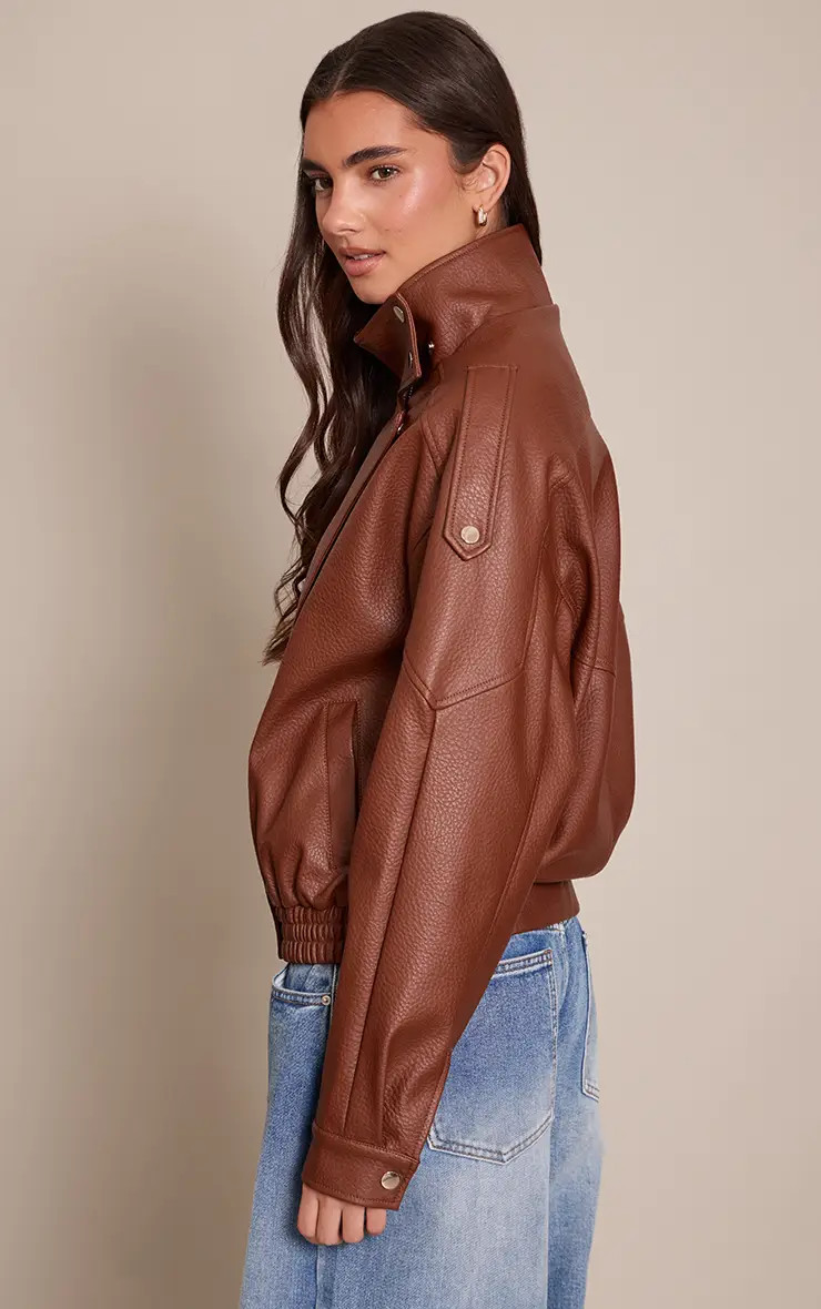 Jackets & Coats | Brown Funnel Neck Faux Leather Biker Jacket | PrettyLittleThing | PrettyLittleThing UK