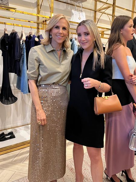 Last night with Tory Burch! What an honor it was to meet her. She is so chic and so kind. Linking mine and Valeria Lipovetsky’s outfit. Tory’s is part of the new collection that comes out soon. 

The Little black dress I’m wearing is true to size I’m in a 0 and the dress has pockets and gold adjustable zipper at the neck. Wear the collar popped up for a cooler look or down for a preppier look. Also linking my new Tory Burch purse that just came out and is so chic. It also comes in black and comes with a removable shoulder strap to wear crossbody. 

Mirror skirt, button down shirt, Tory Burch, black dress, mom style, color block dress, work dress, work to happy hour 

#LTKitbag #LTKworkwear #LTKstyletip